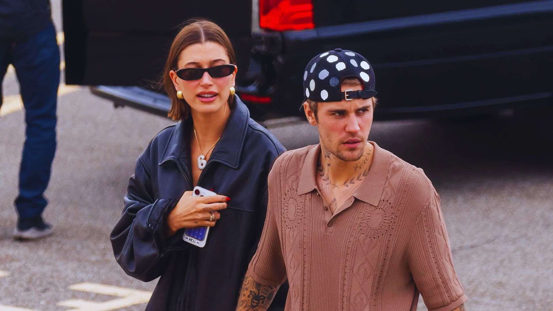 Justin Bieber and Amanda Seyfried smiling together, indicating they are back in a relationship.