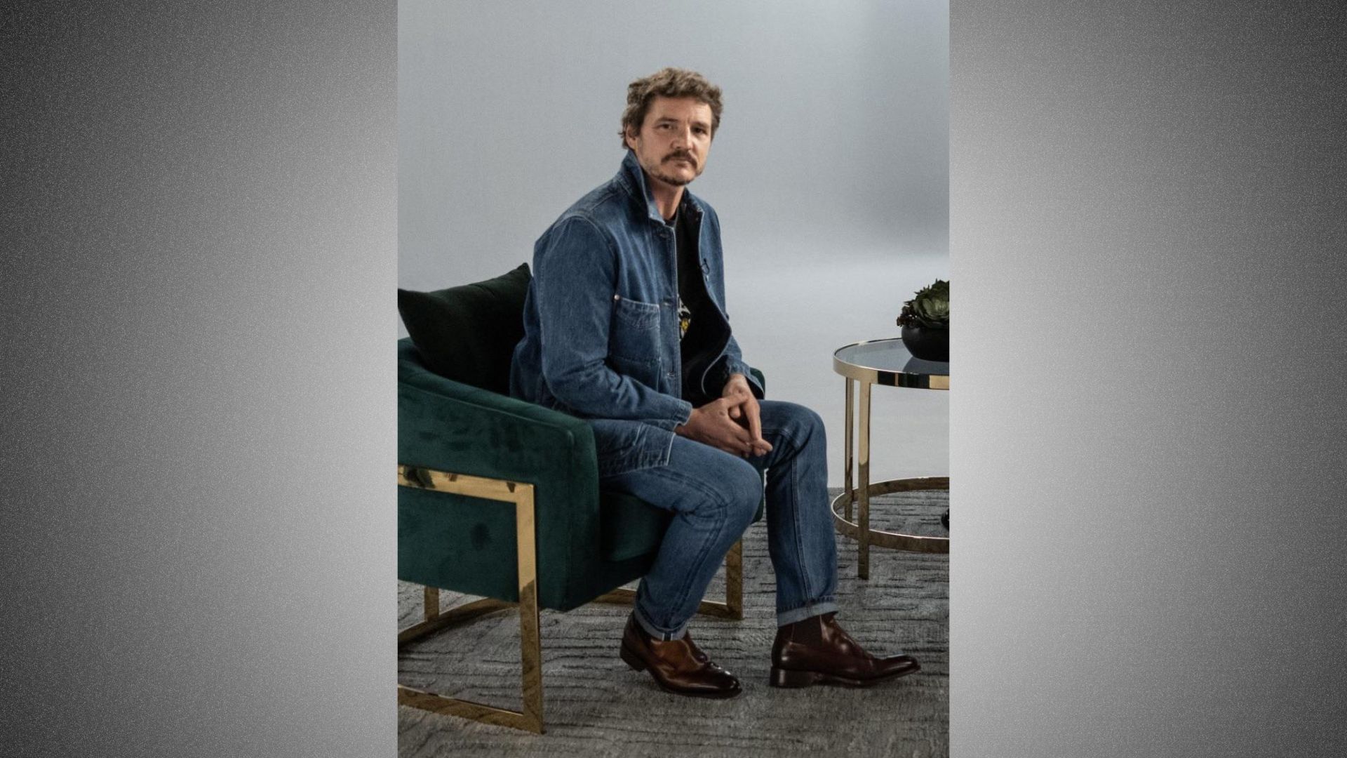 2. A man seated on a chair in a cozy room, with soft lighting and neutral decor.