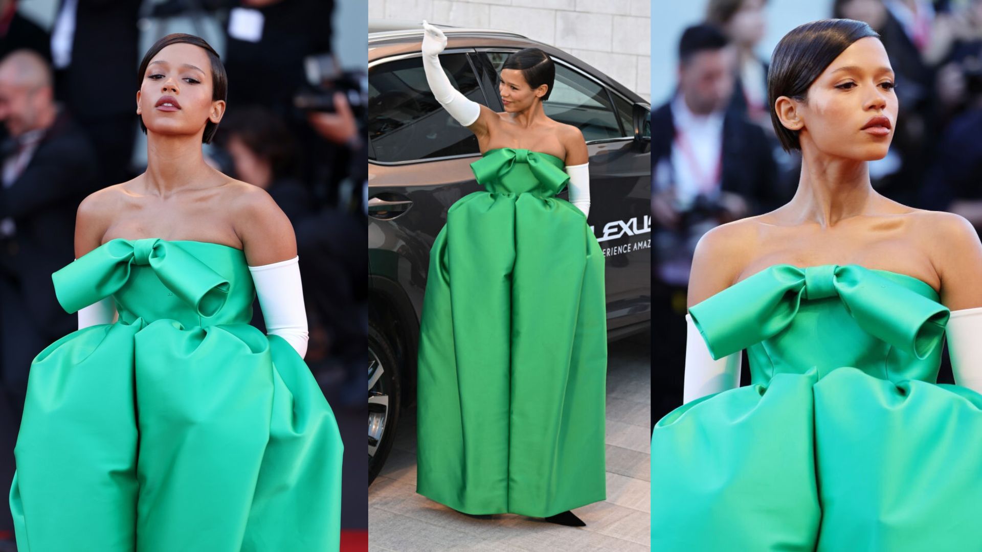 Taylor Russell in a green Balenciaga gown and white gloves poses elegantly on the red carpet.