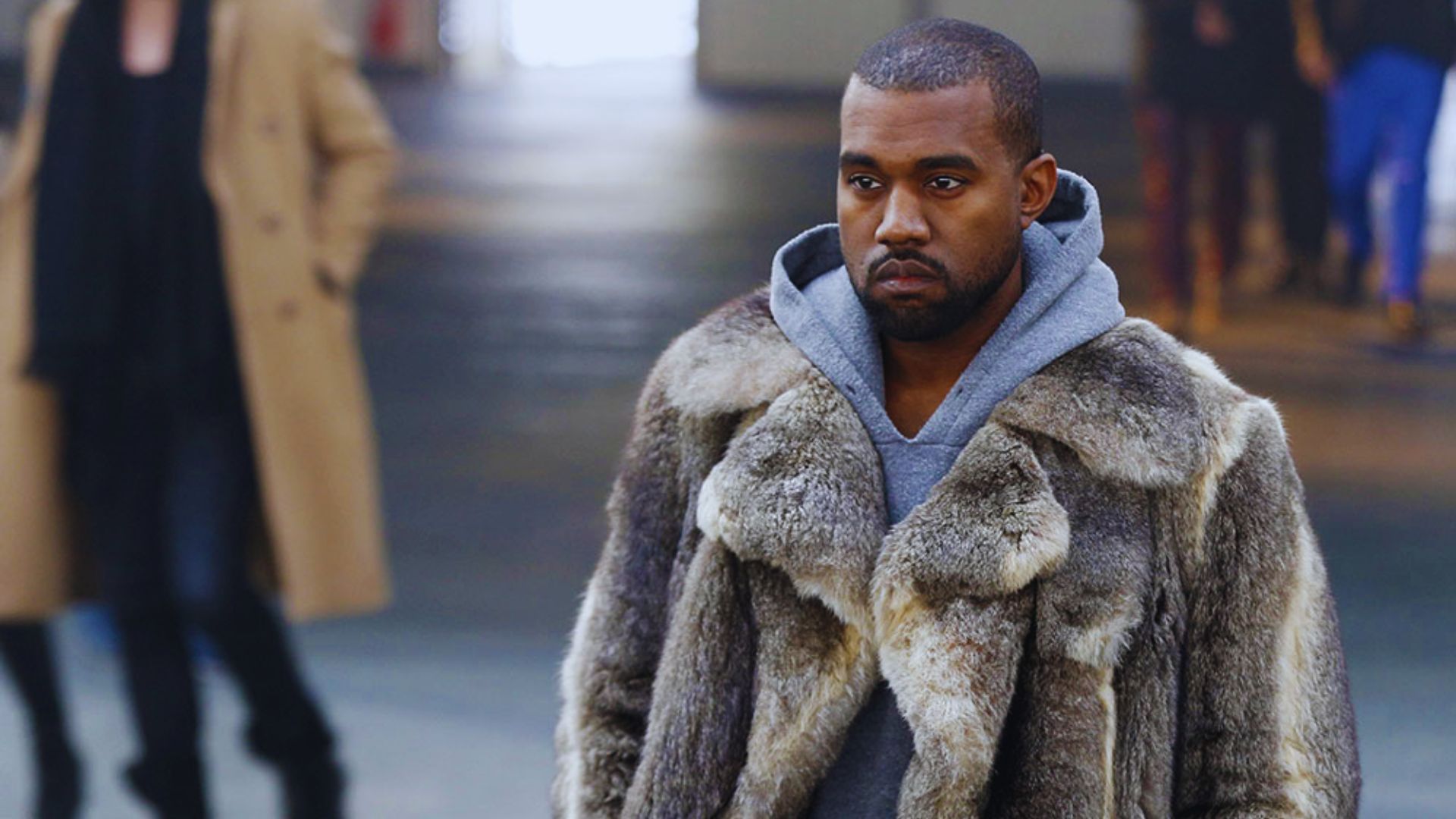 A luxurious fur coat worn by Kanye West, highlighting a must-have look for the fall season.