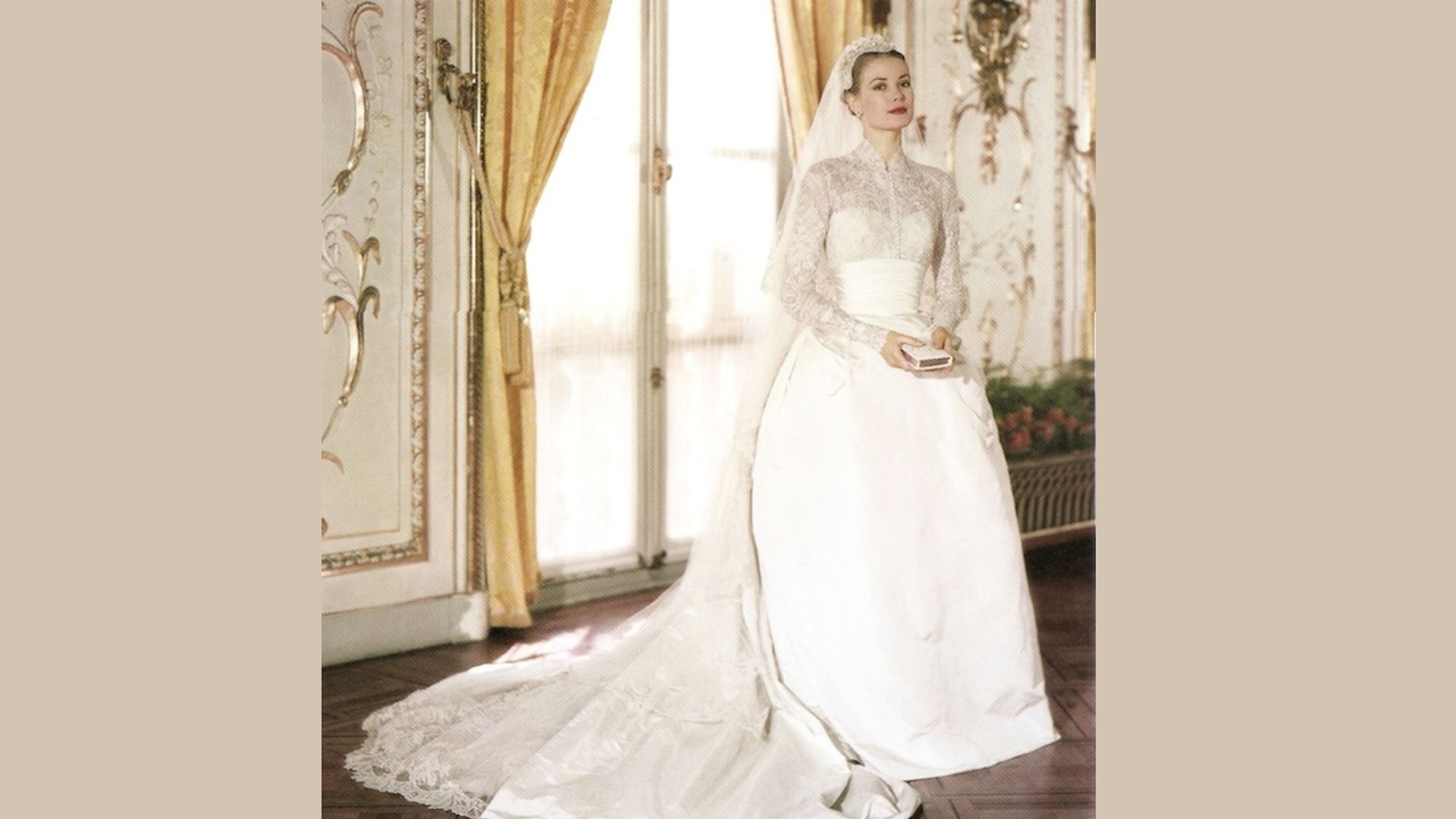 1. A woman in a wedding dress stands elegantly in a beautifully decorated room, radiating joy and anticipation.