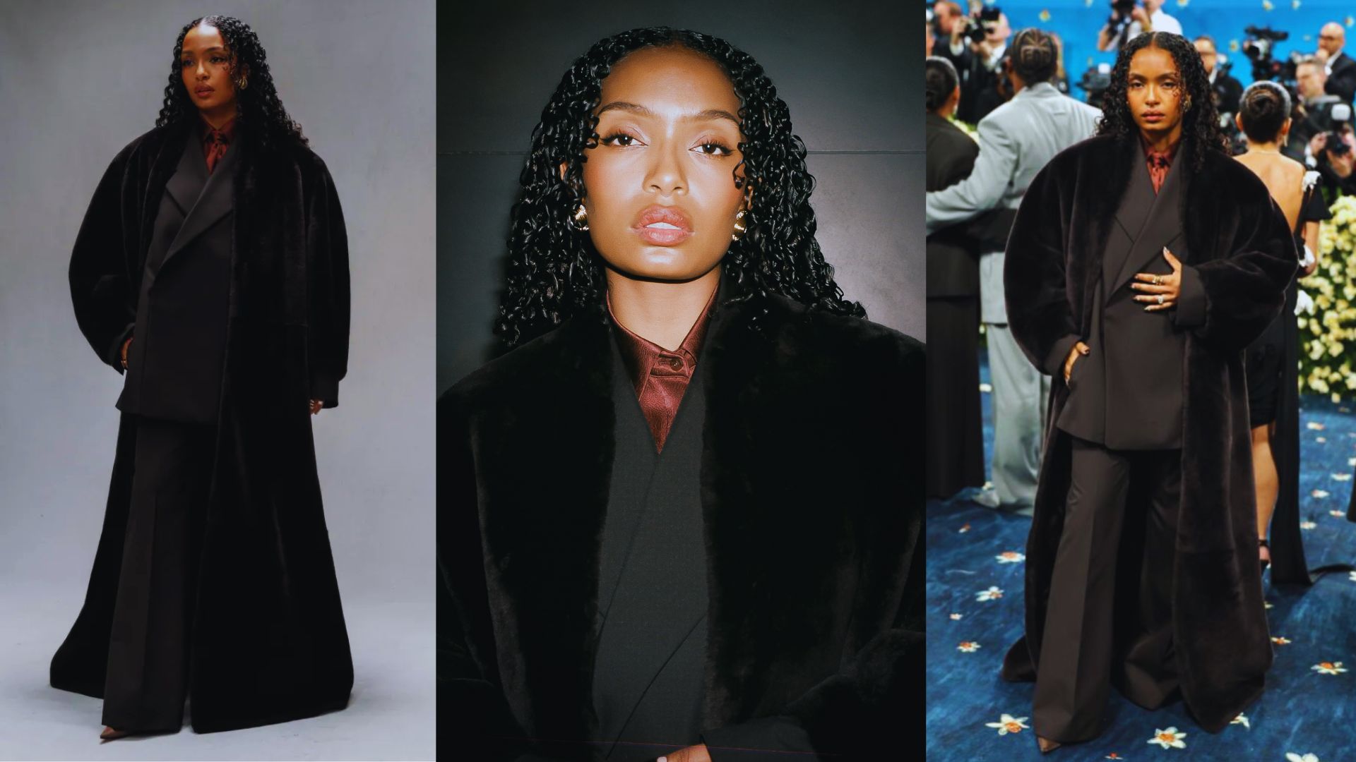 A woman wearing a black coat and pants stands on a blue carpet.
