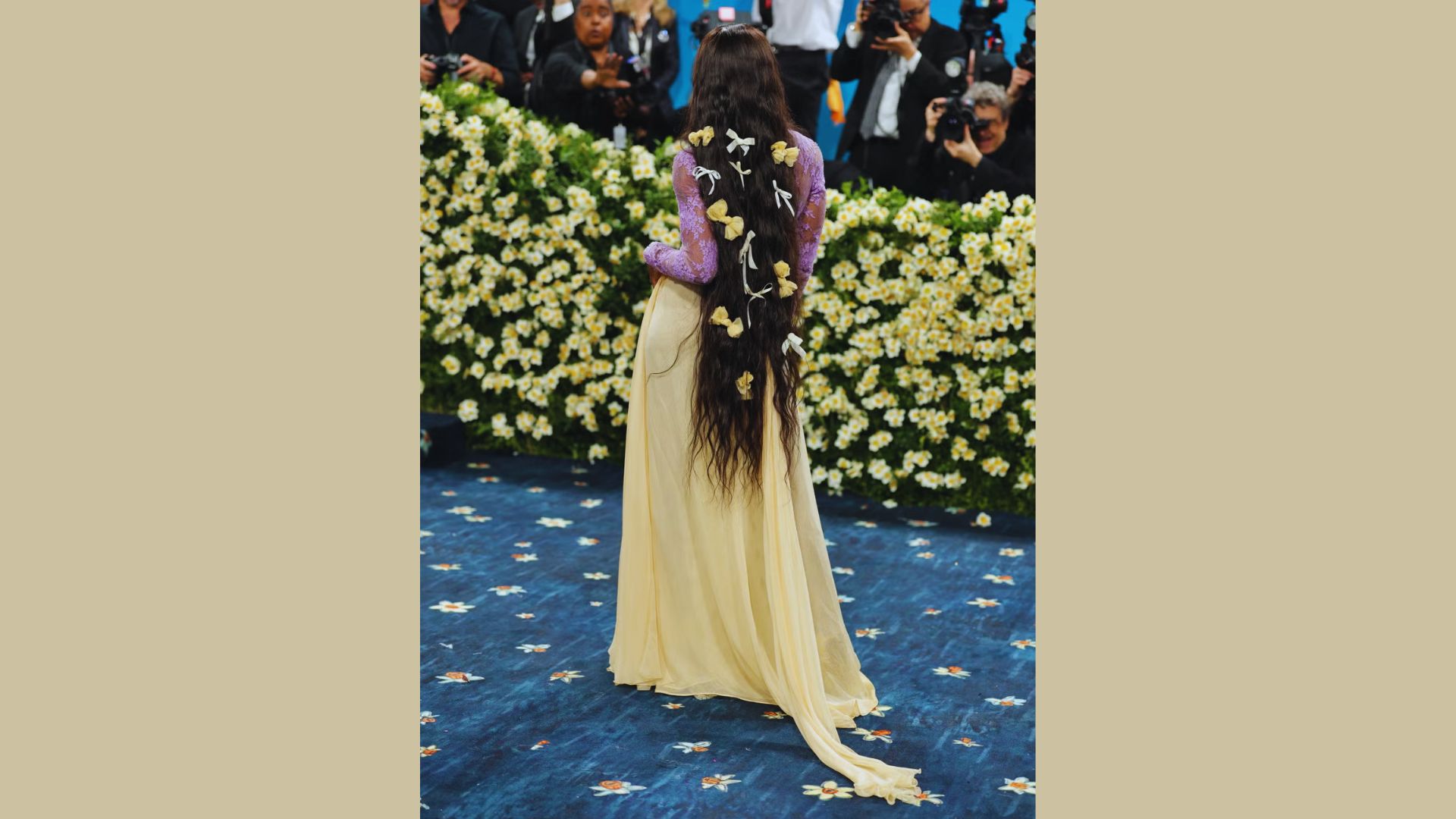 Sha’with long hair wearing a vibrant yellow dress at the Met Gala 2025, showcasing her hair and makeup.