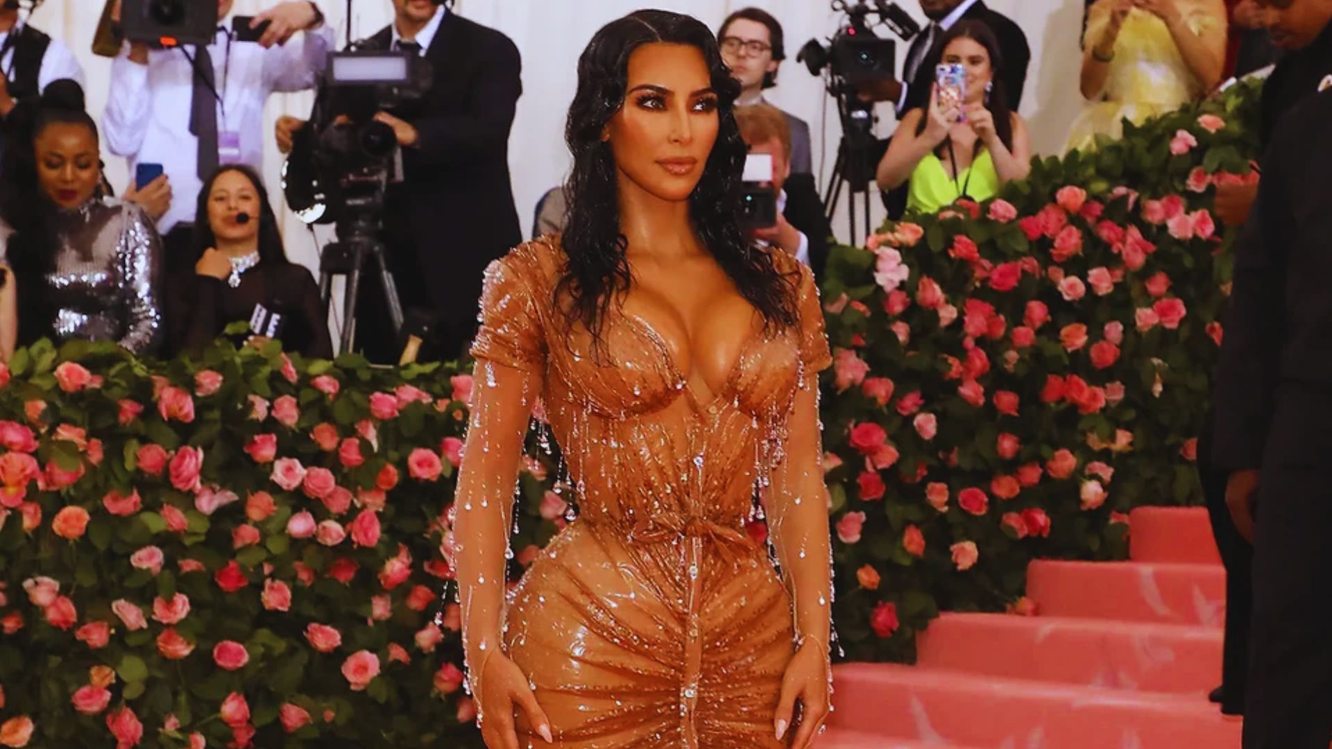 Kim Kardashian's Met Gala outfit features a nostalgic design, reminiscent of past fashion trends and iconic styles.