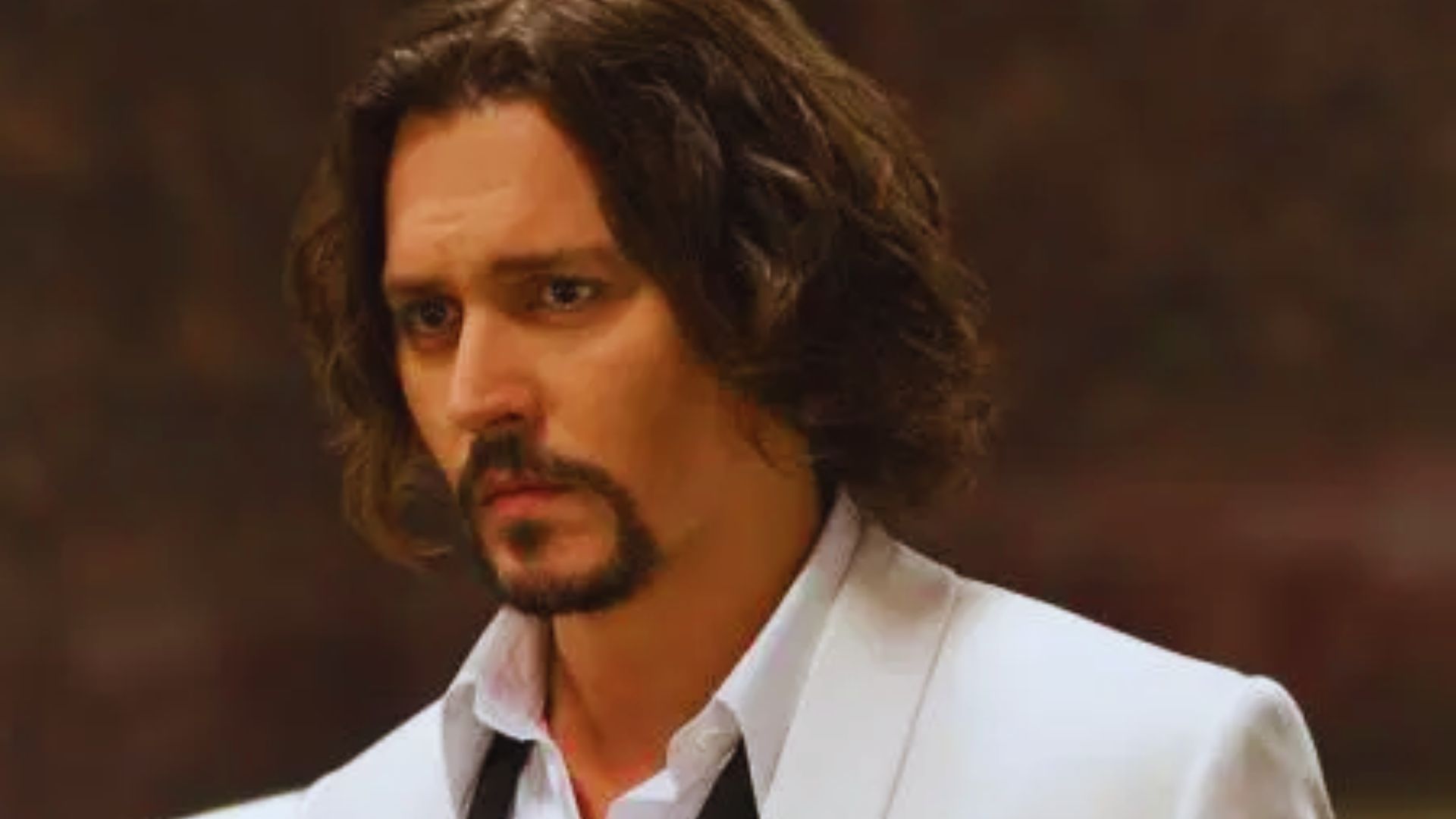 Johnny Depp appears in a shadowy scene from The Dark Knight, highlighting his dramatic character portrayal.