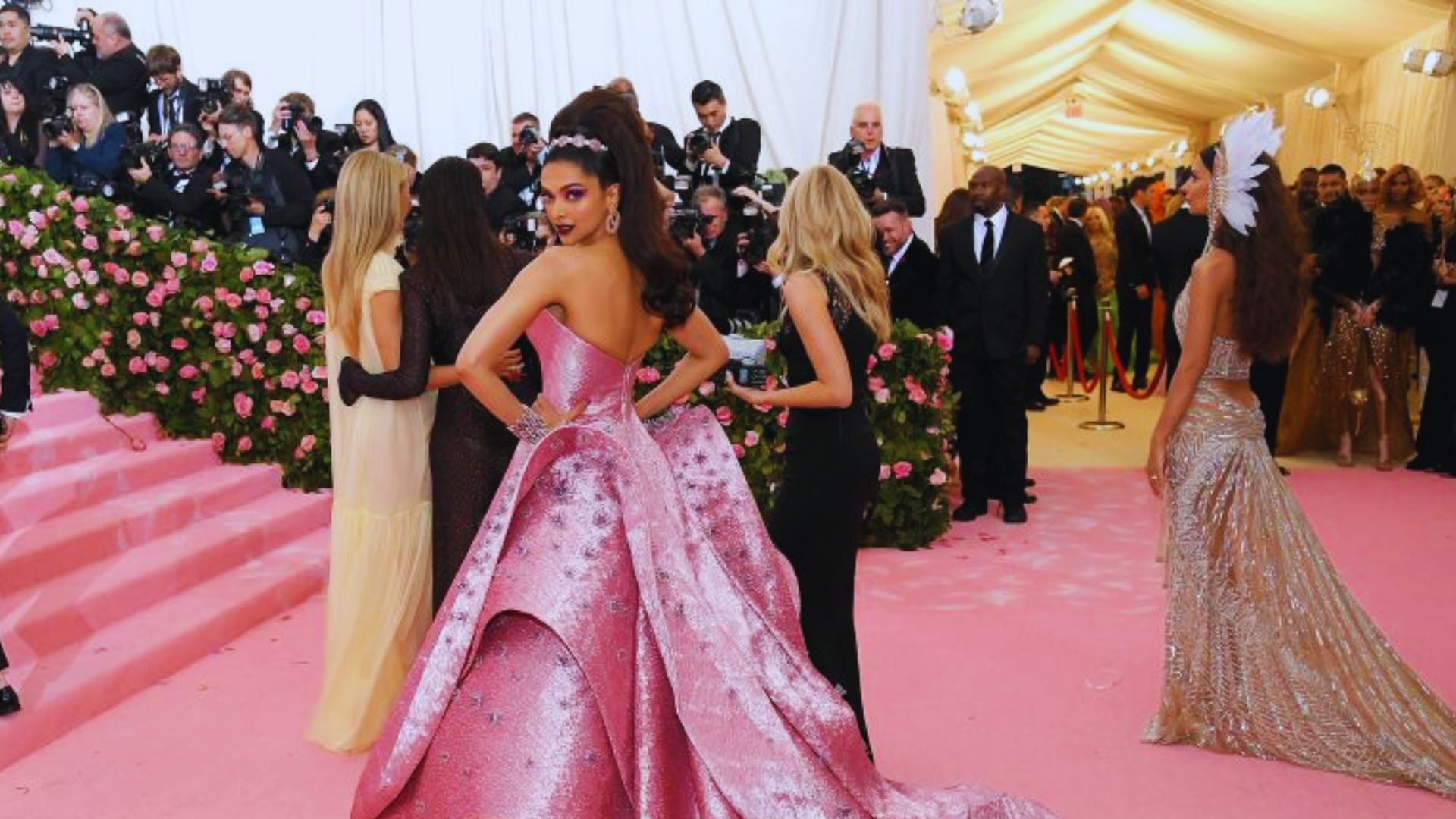 Highlights from the 2019 Met Gala showcasing maximalist outfits on the red carpet.