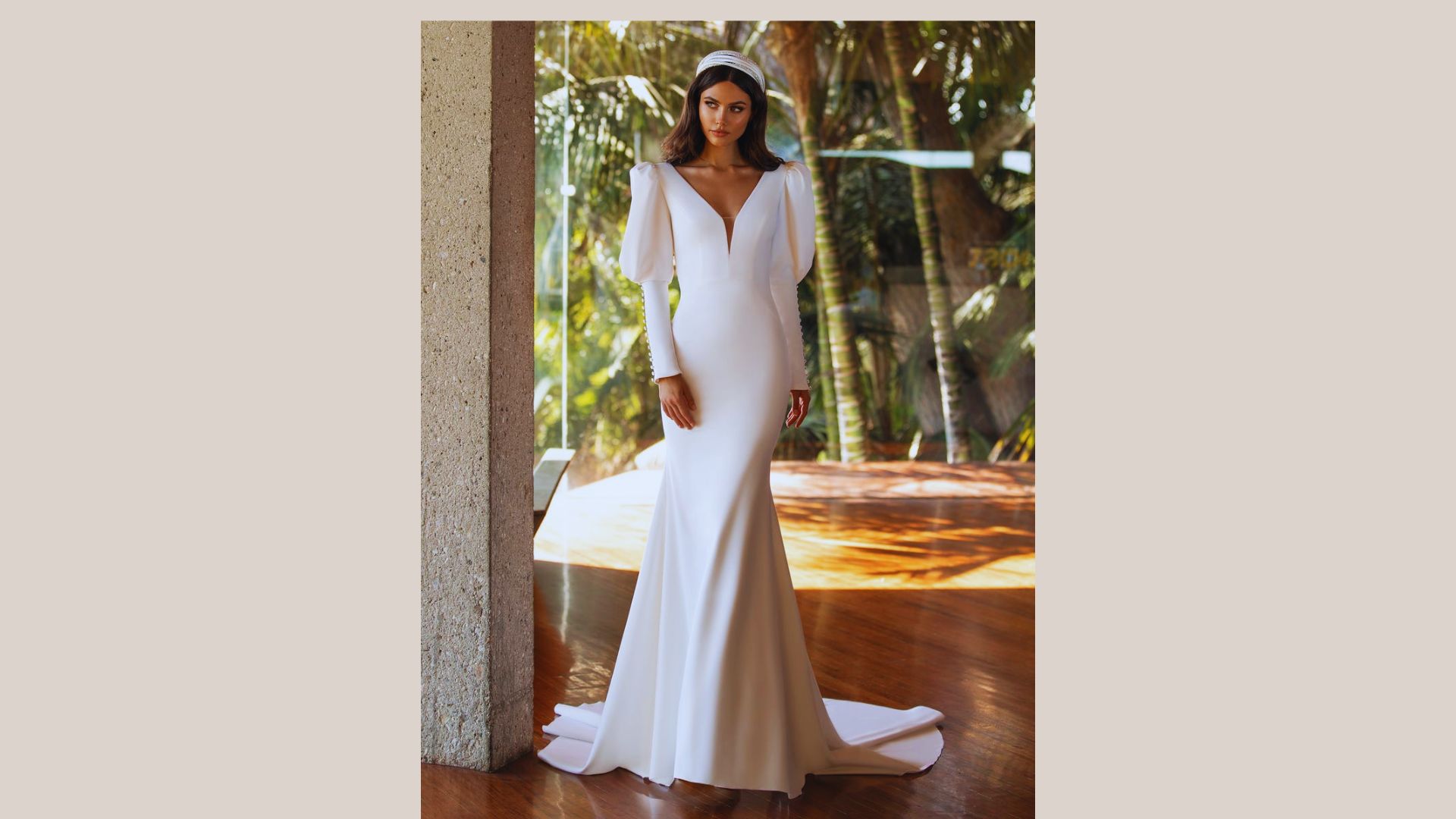 The bride wears a beautiful white wedding dress, highlighting her joyful expression on this special day.
