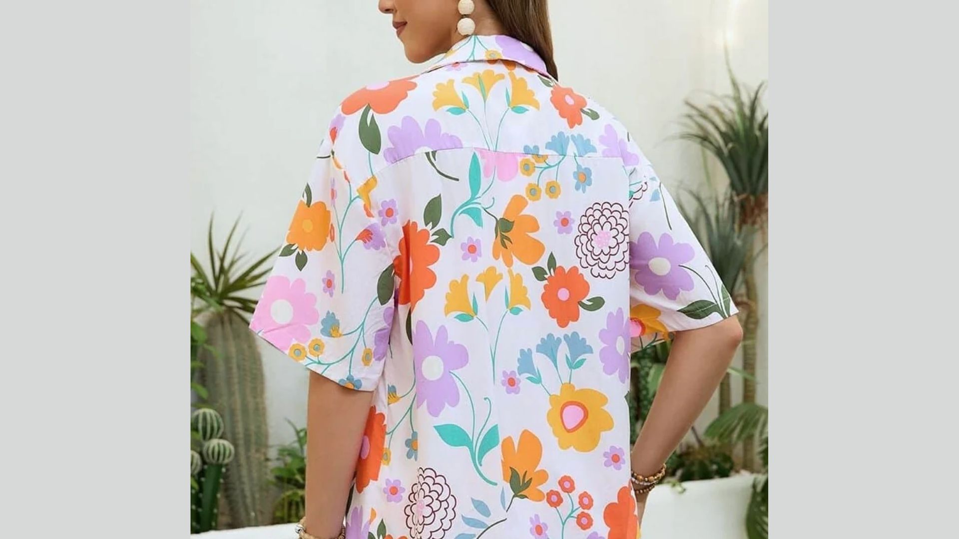 A short sleeve shirt adorned with a colorful floral pattern, perfect for casual wear.