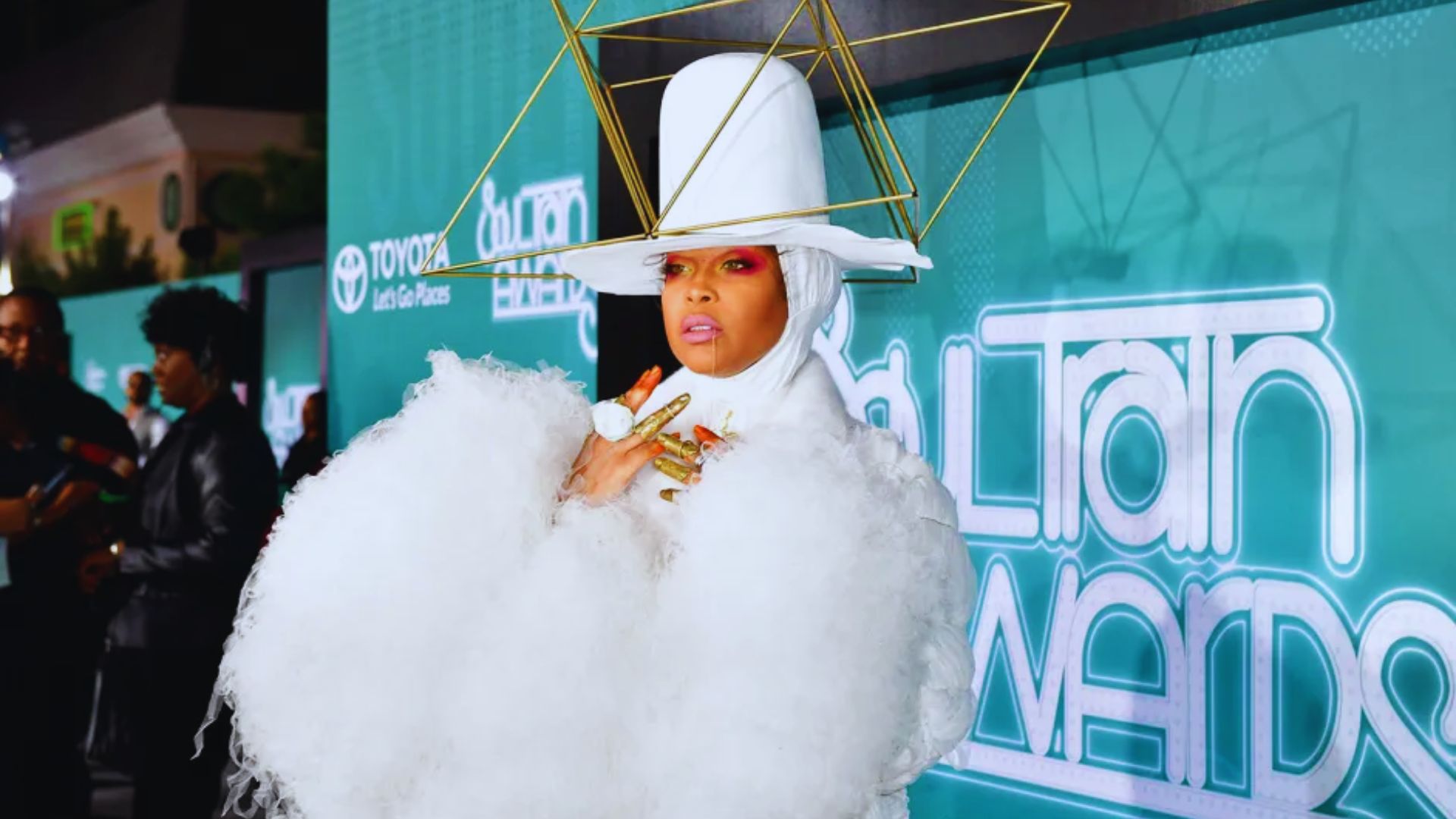 Nicki Minaj wearing a vibrant pink 'Barbie' outfit at the BET Awards, showcasing her signature bold style and personality.