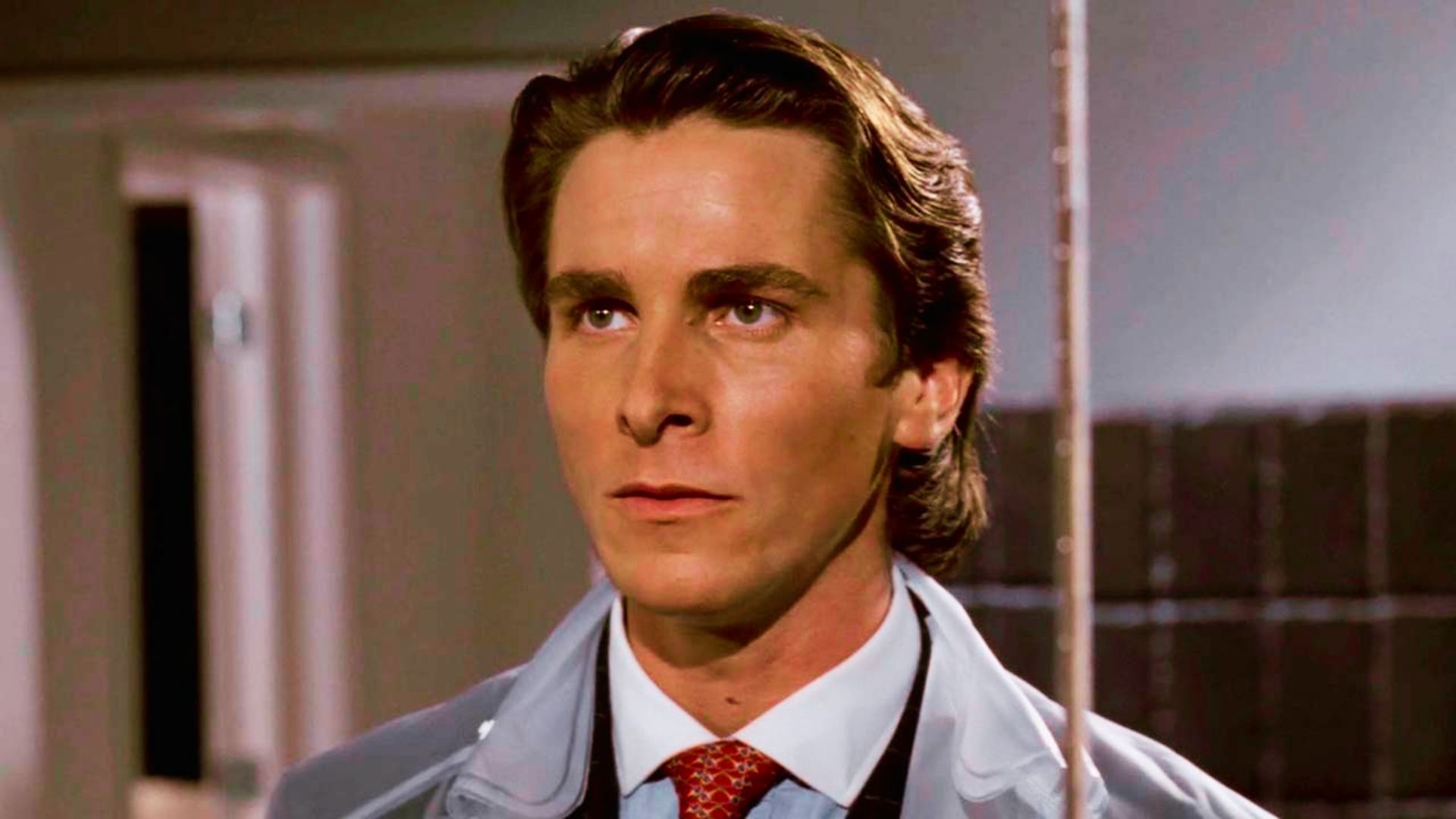 Christian Bale in a suit and tie in American Psycho