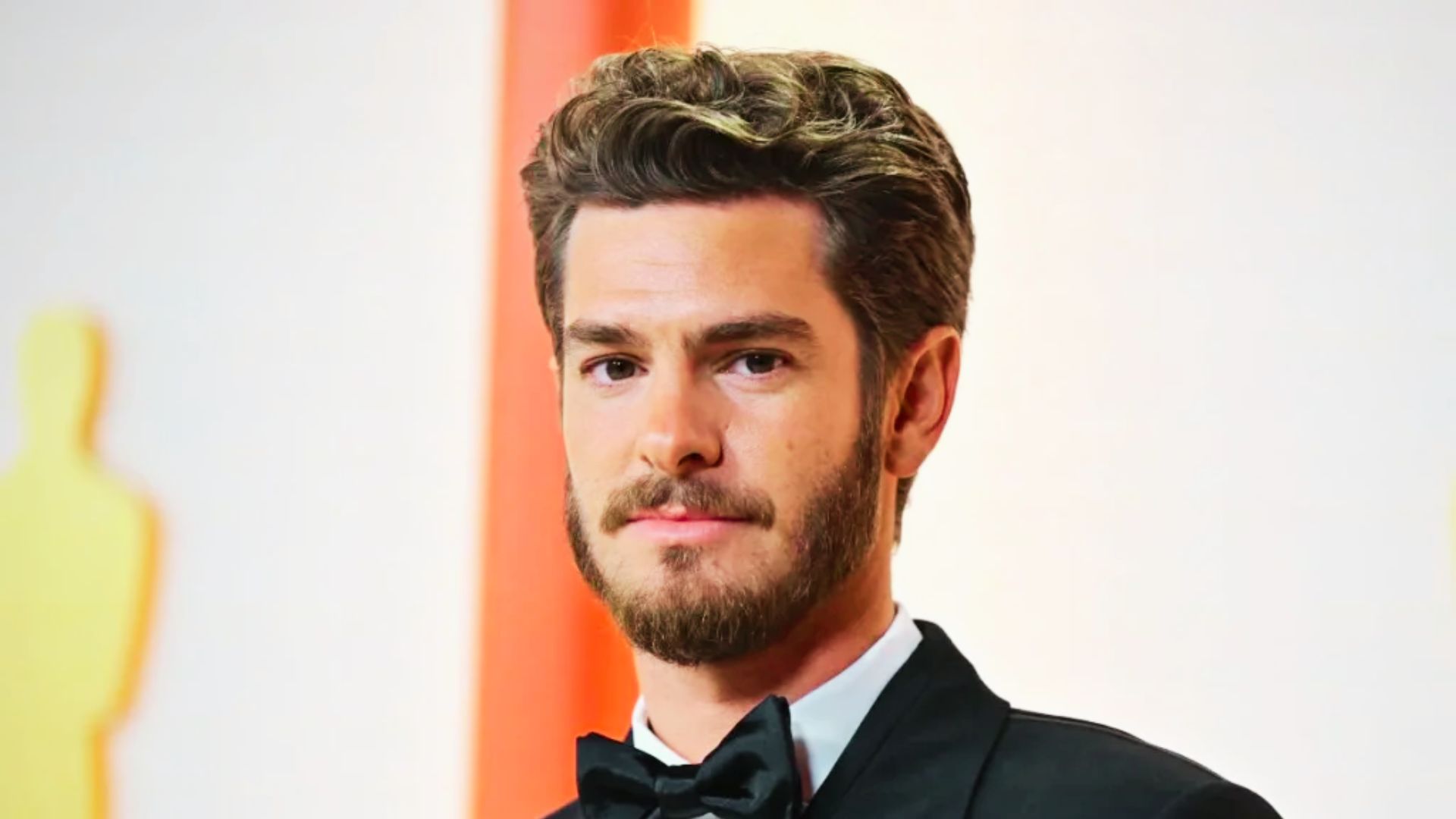 Andrew Garfield with his distinctive haircut, known for its textured and stylish appearance.