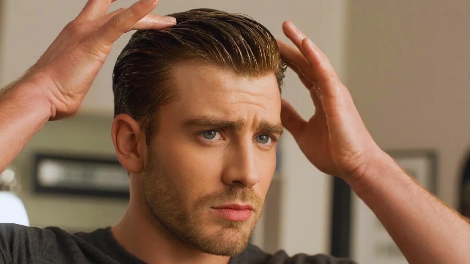 Chris Evans influenced hairstyle with matte clay applied for natural non-shiny textured finish in close-up
