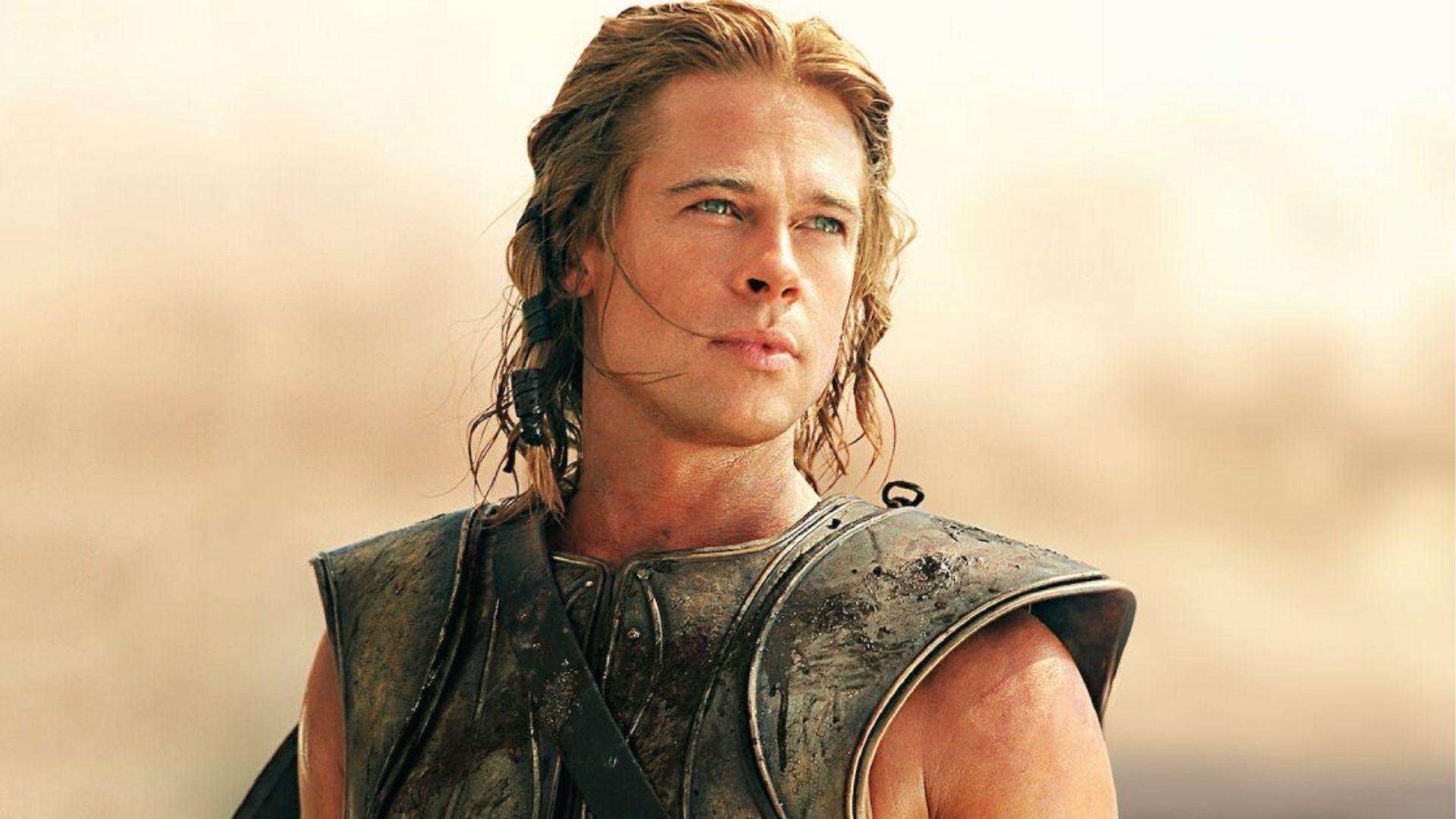 Brad Pitt as Achilles in Troy, shoulder length blond hair in braids, wearing battle armor