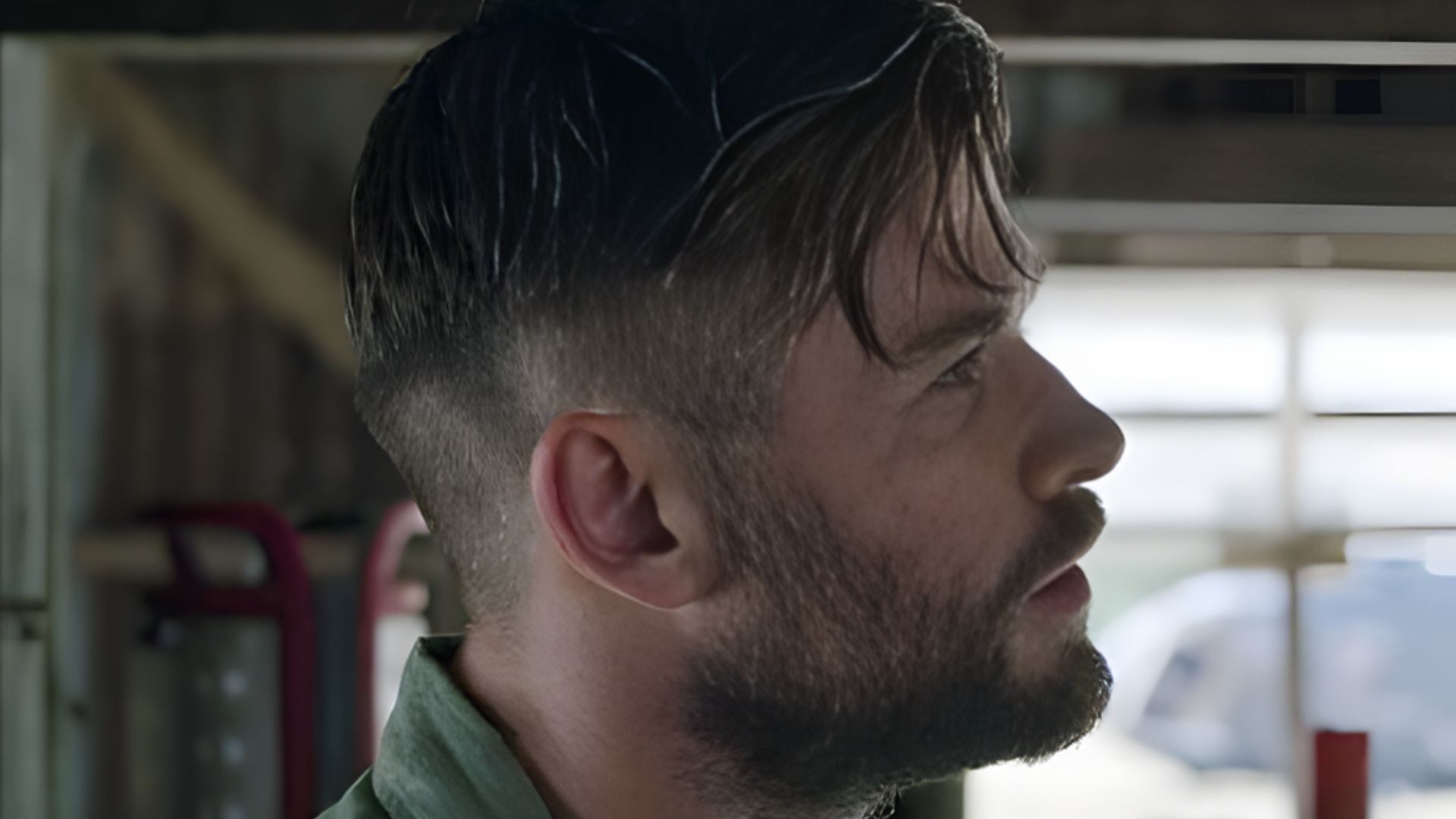 Chris Hemsworth highlighting a taper fade hairstyle with a side sweep