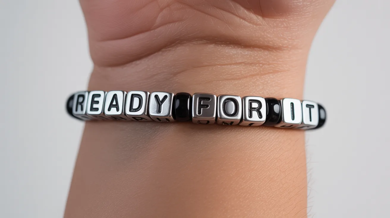 black and silver bracelet on wrist with cube beads spelling READY FOR IT in sharp uppercase letters.