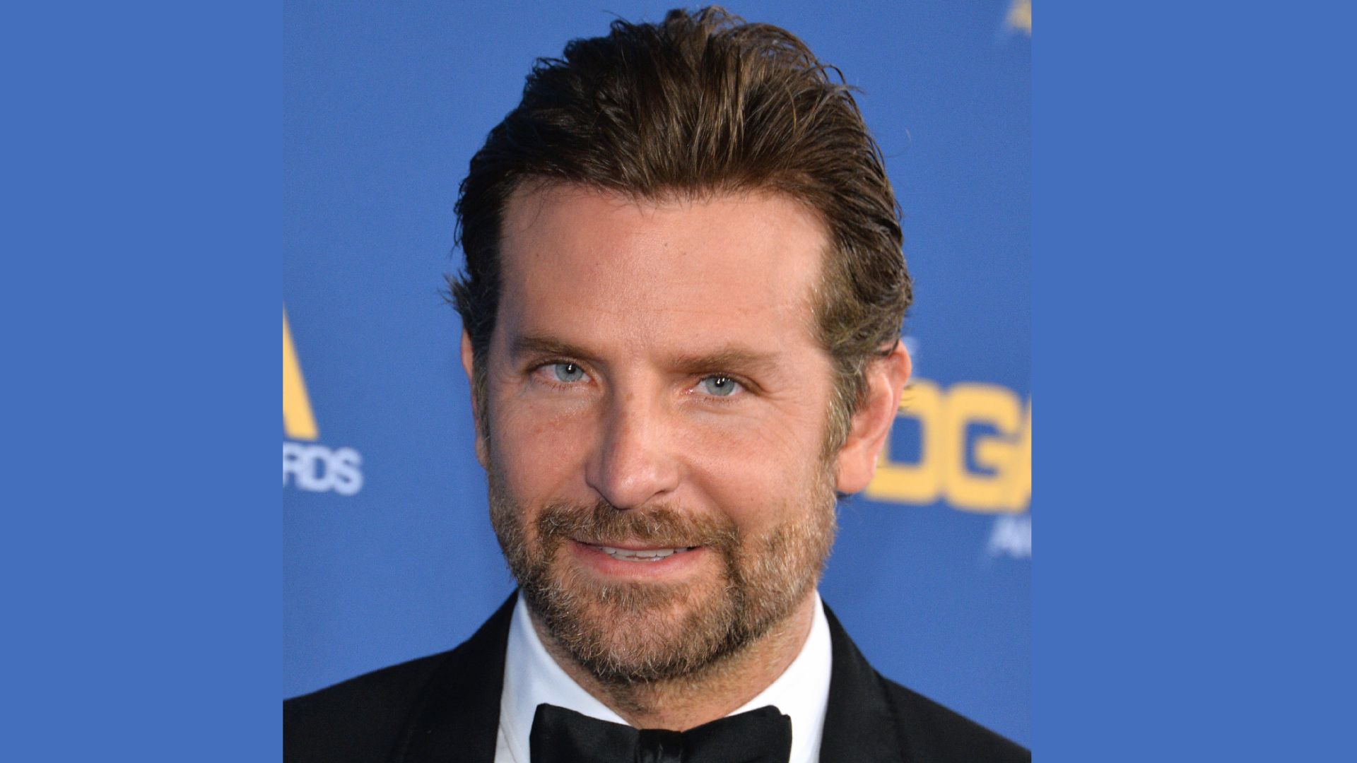 Bradley Cooper showcasing a stylish haircut with Pushed- Back medium length Hair.