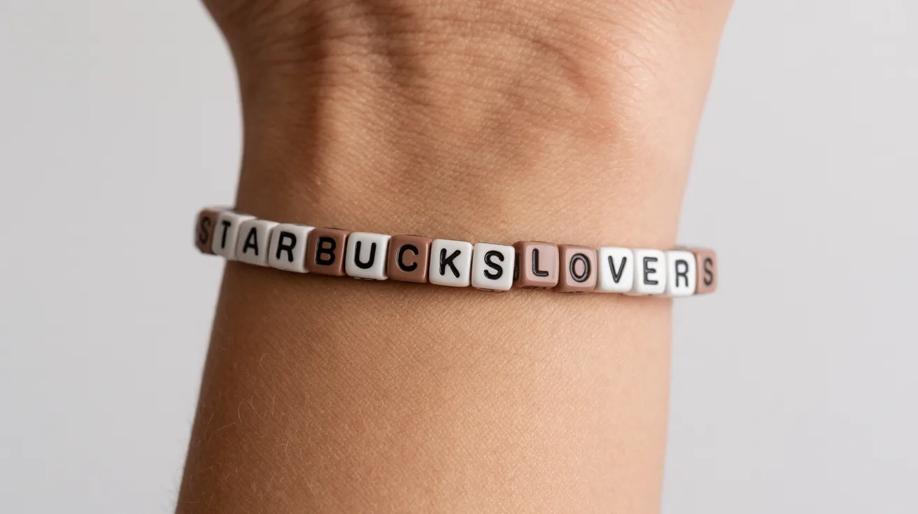 brown and white bracelet on wrist with cube beads spelling STARBUCKS LOVERS in uppercase.