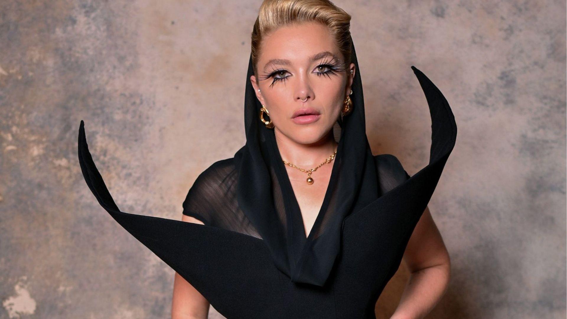 Florence Pugh goes avant-garde in sculptural black gown with dramatic spiky lashes.