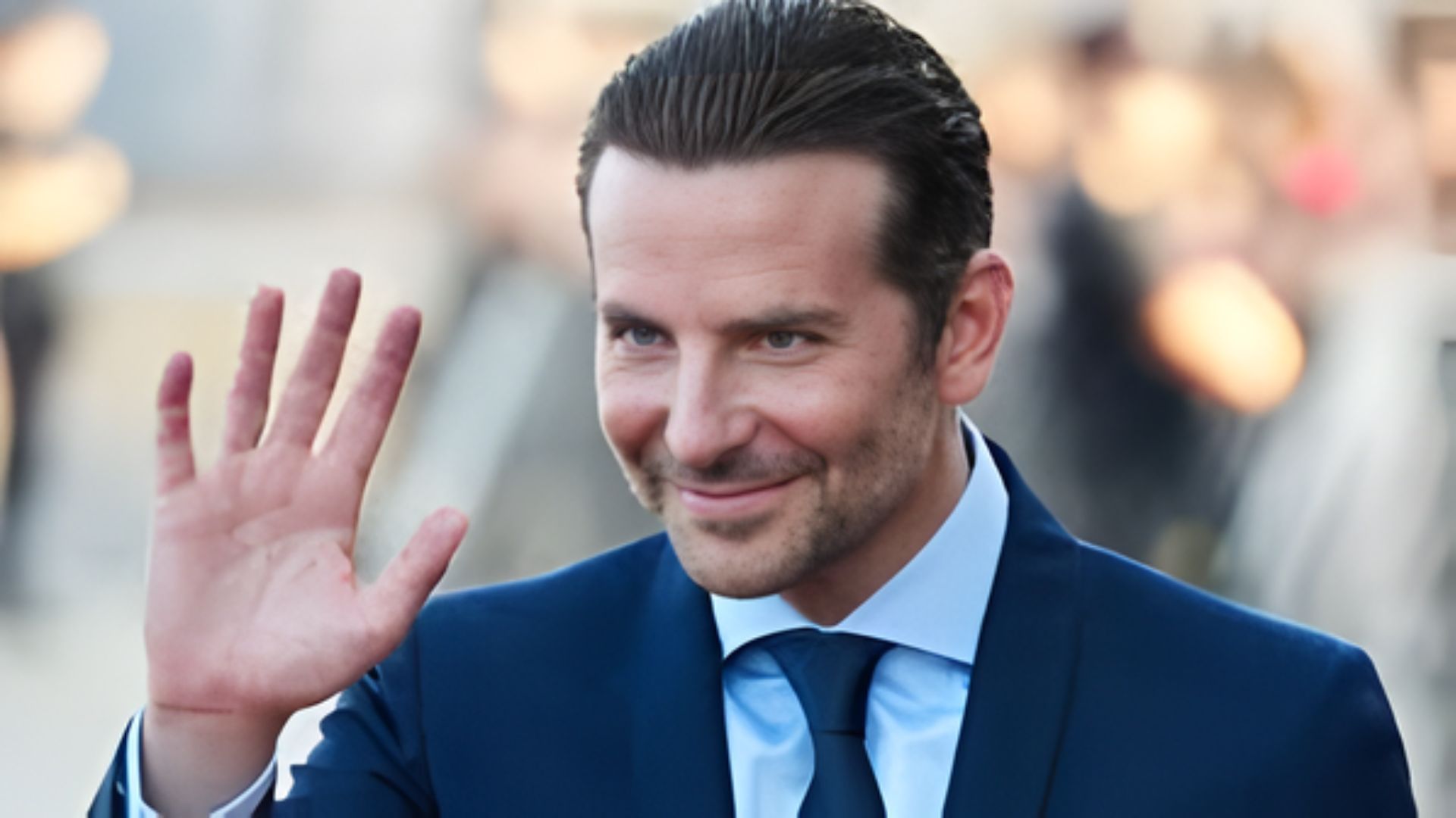 Bradley Cooper showcasing a guide to achieving his popular haircut style.