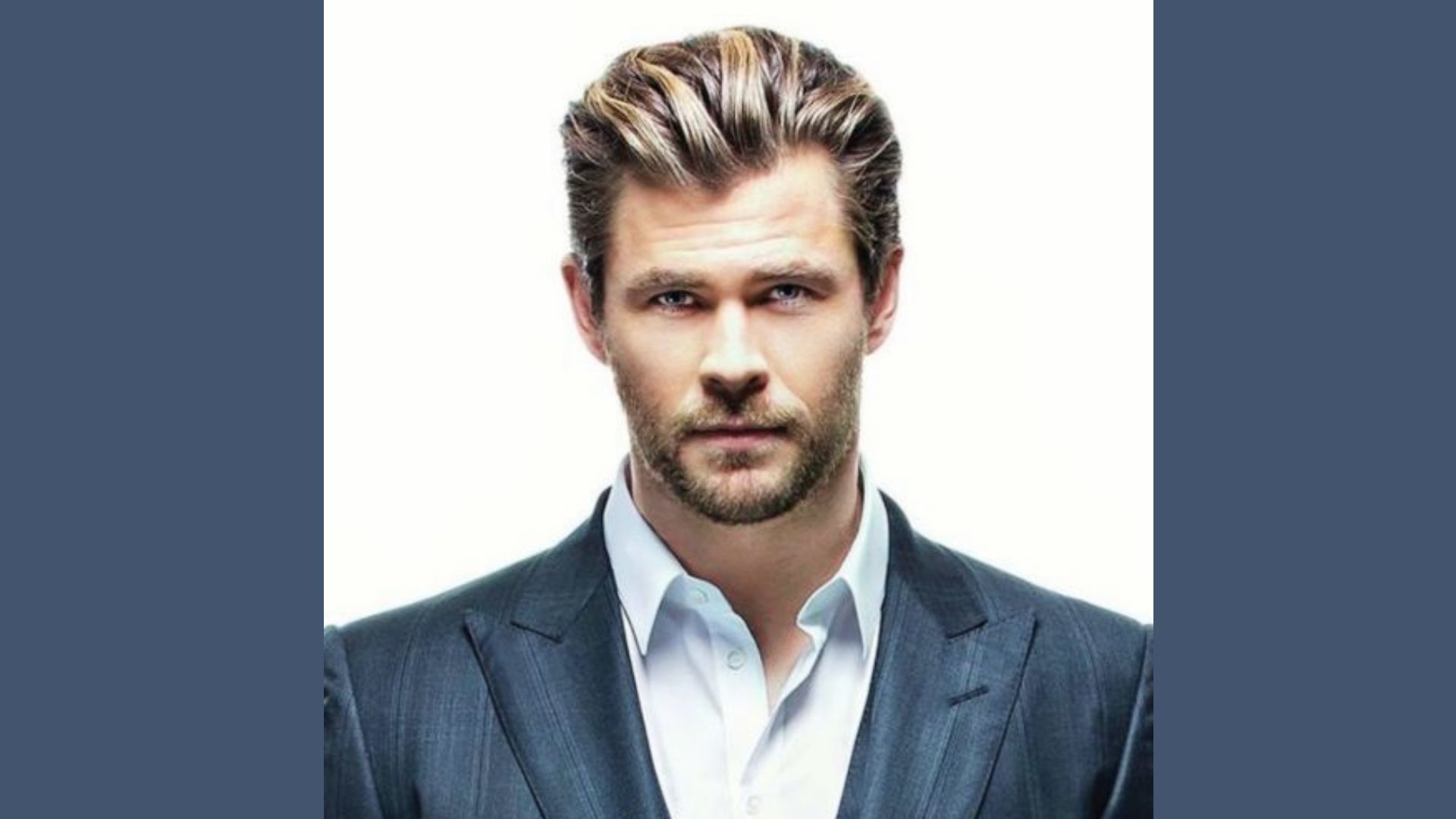 Chris Hemsworth with a beard wearing a Coat, showcasing a Slicked black medium hairstyle for inspiration.