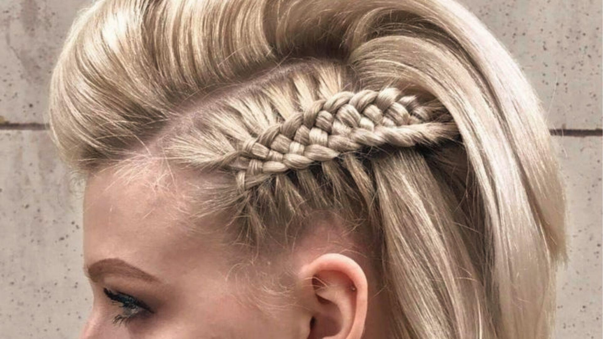 Close-up of blonde undercut pixie with braided side detail and voluminous swept-back top.