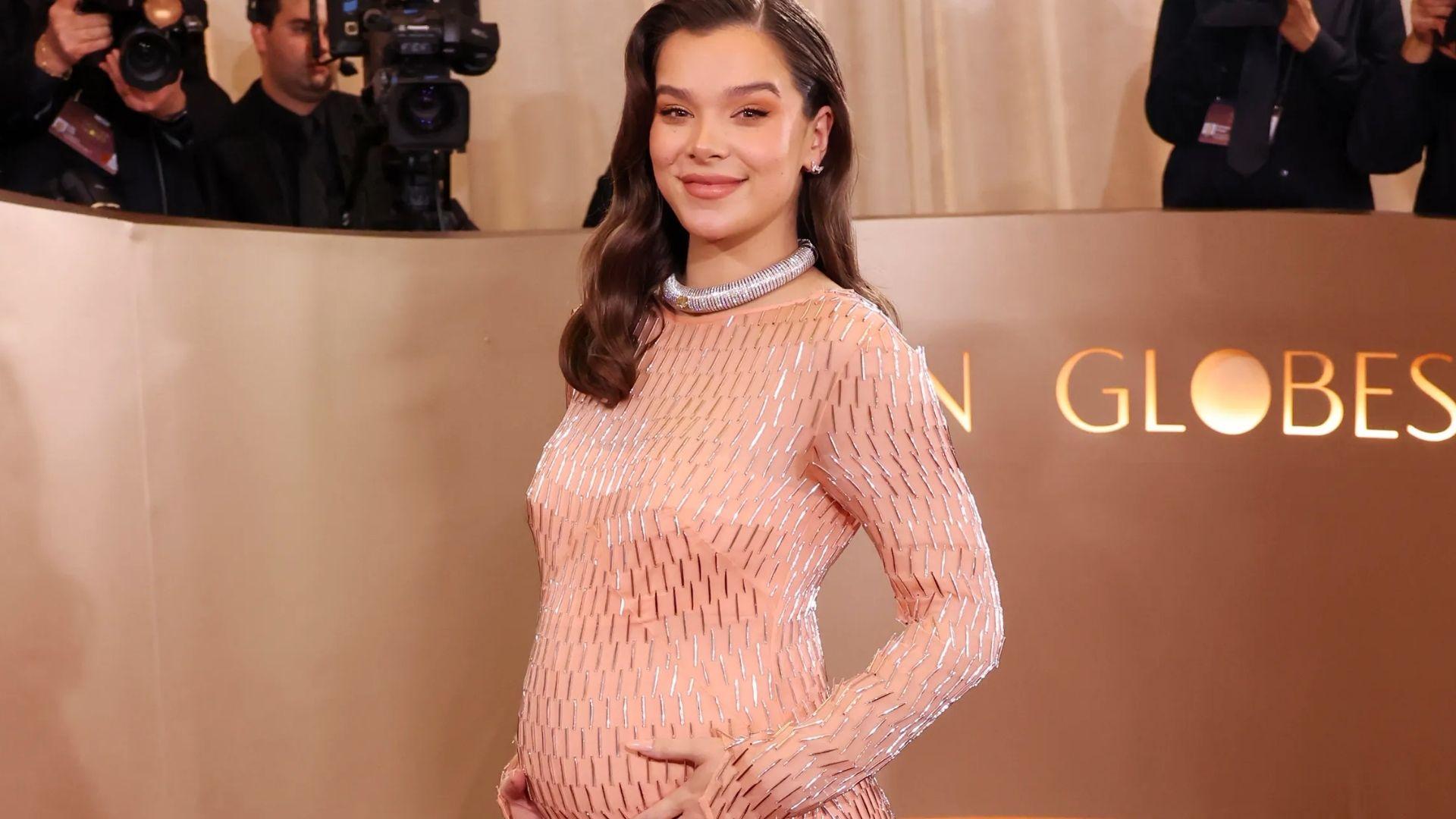 Hailee Steinfeld wearing a pink Prada maternity dress at the 2026 Golden Globe Awards.
