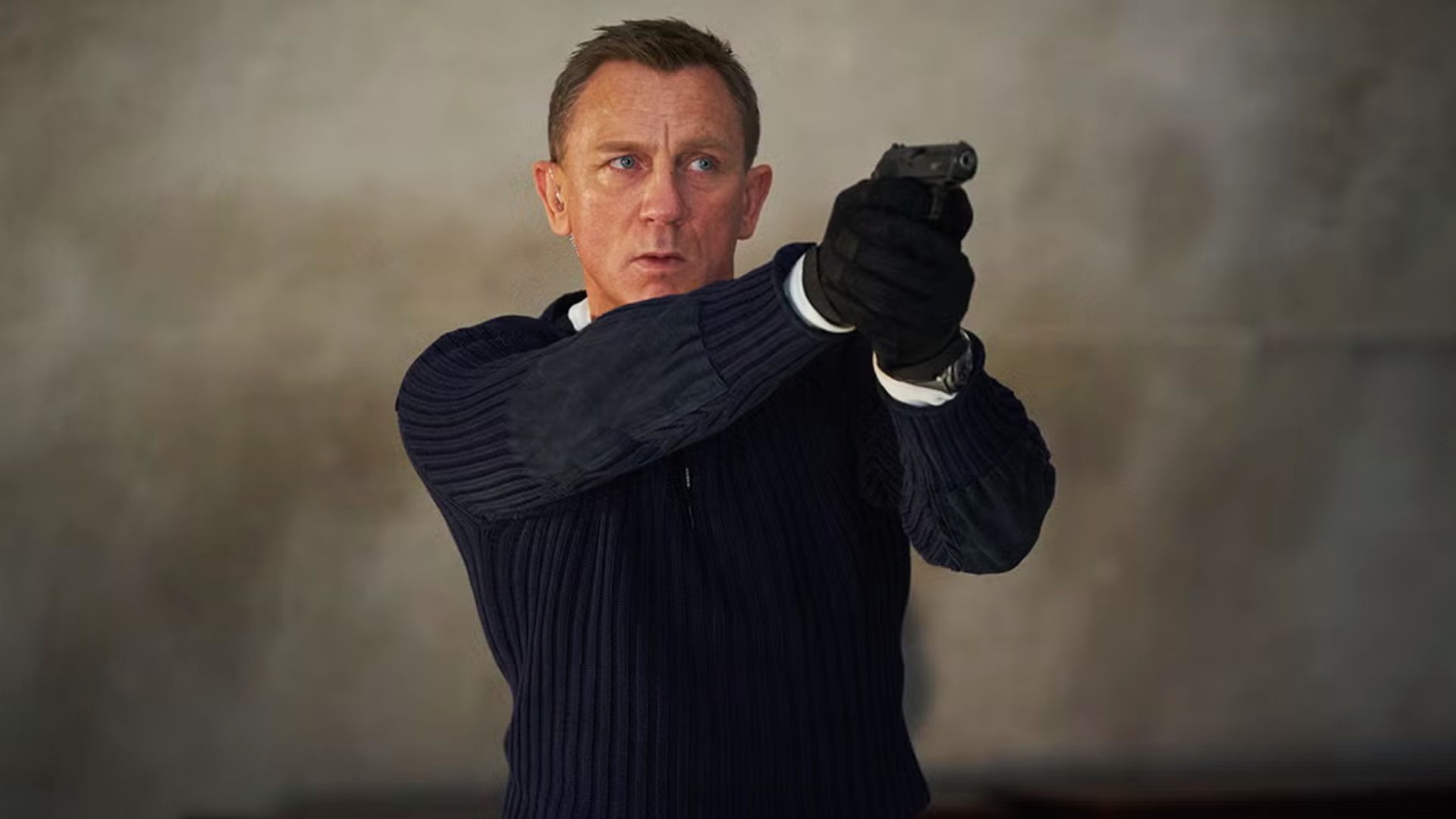 Daniel Craig as James Bond in Skyfall, showcasing his iconic hairstyle in a stylish and action-oriented pose.