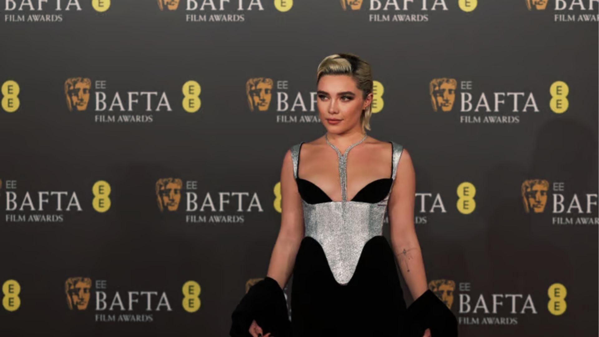 Florence Pugh slays BAFTA carpet in futuristic silver and black corset gown.