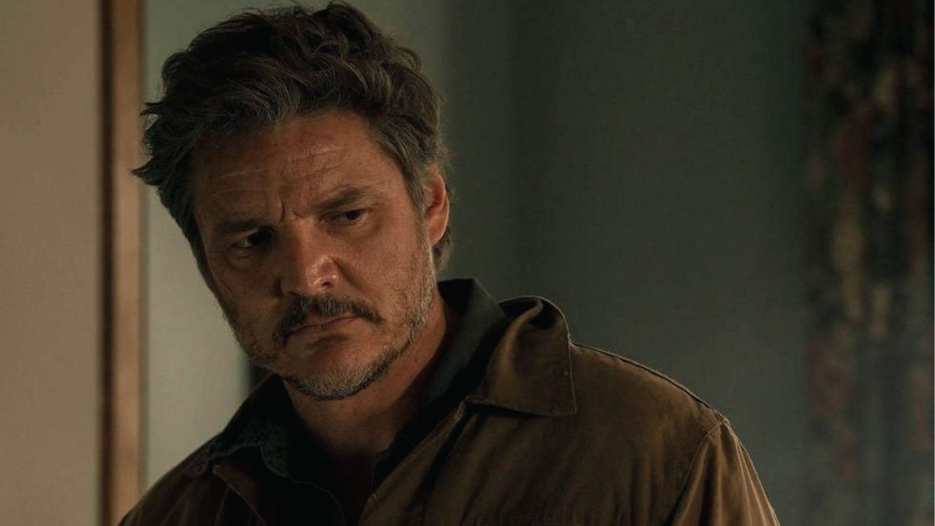 Pedro Pascal as Joel with tousled gray haircut and stubble in jacket from The Last of Us series