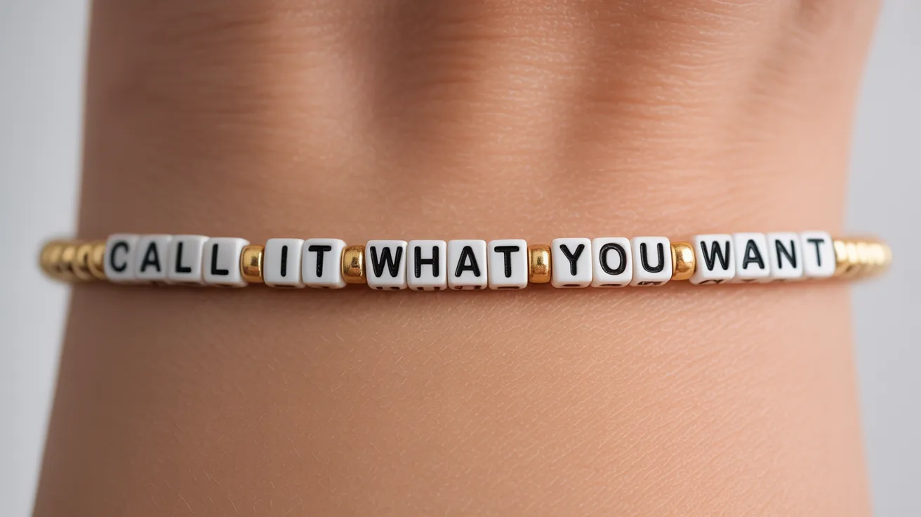 wrist close-up with cream and gold bracelet showing cube letter beads spelling CALL IT WHAT YOU WANT clearly.