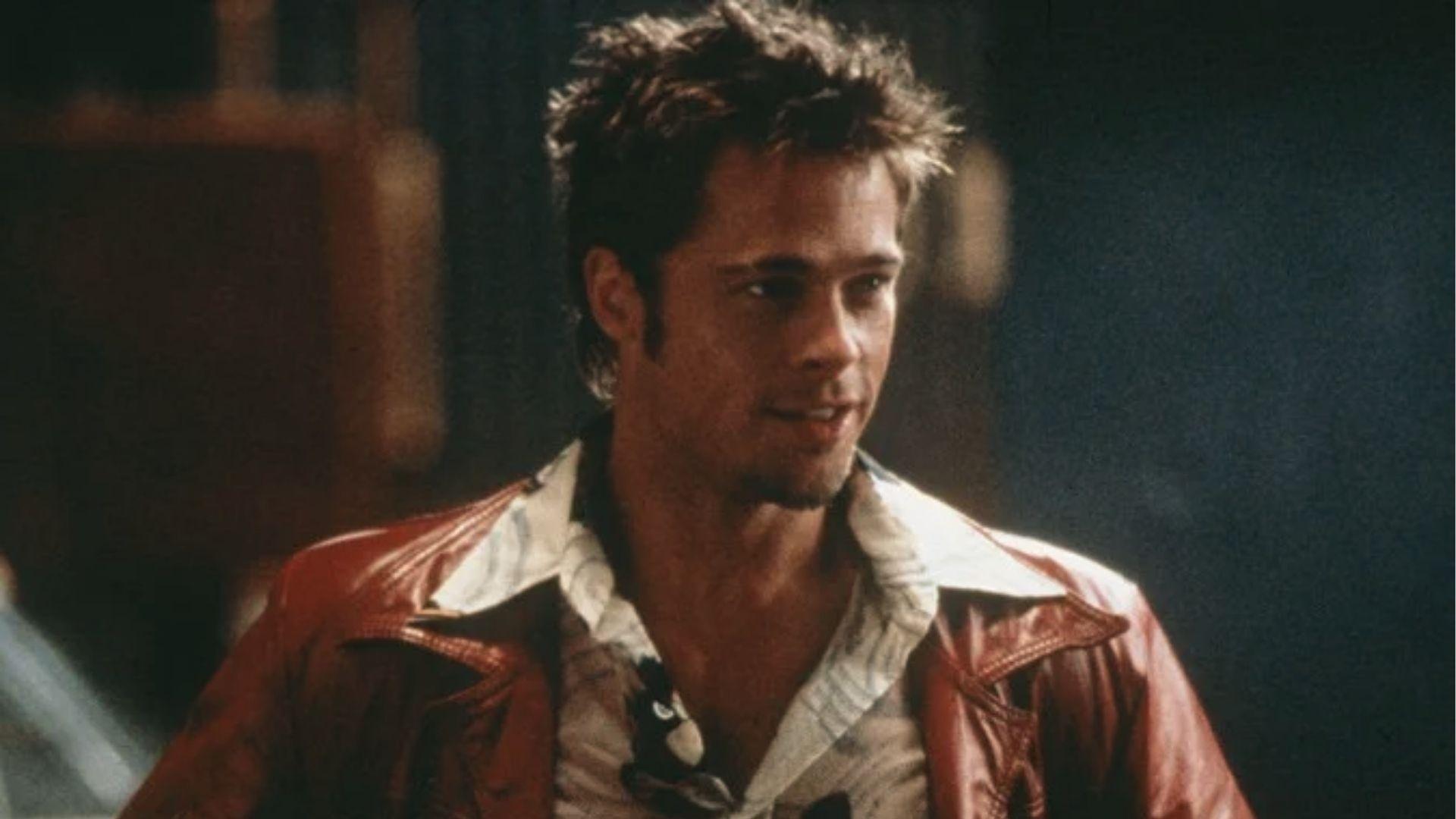 Brad Pitt in red leather jacket, messy medium hair and goatee, Fight Club look