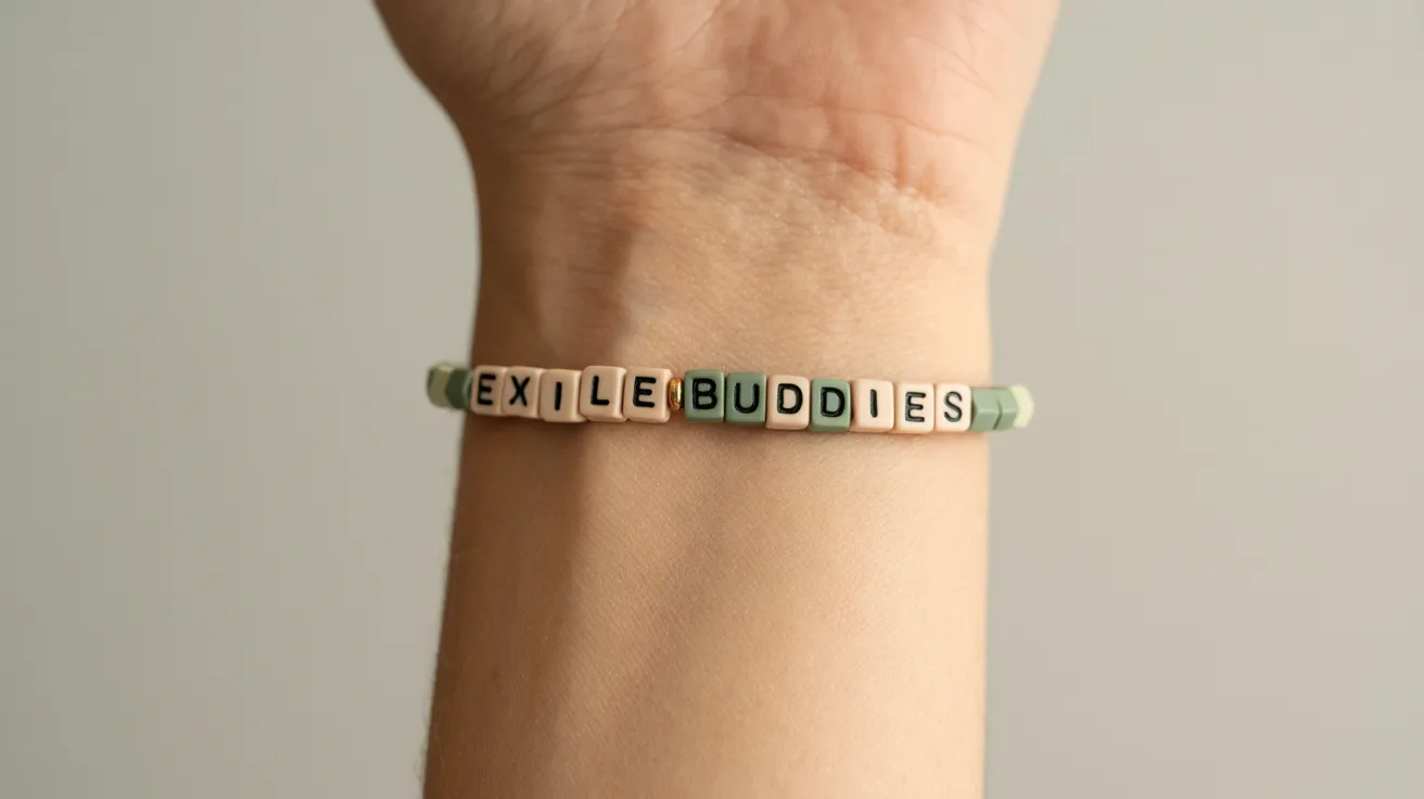 muted tone bracelet on wrist with cube beads spelling EXILE BUDDIES in clean uppercase.