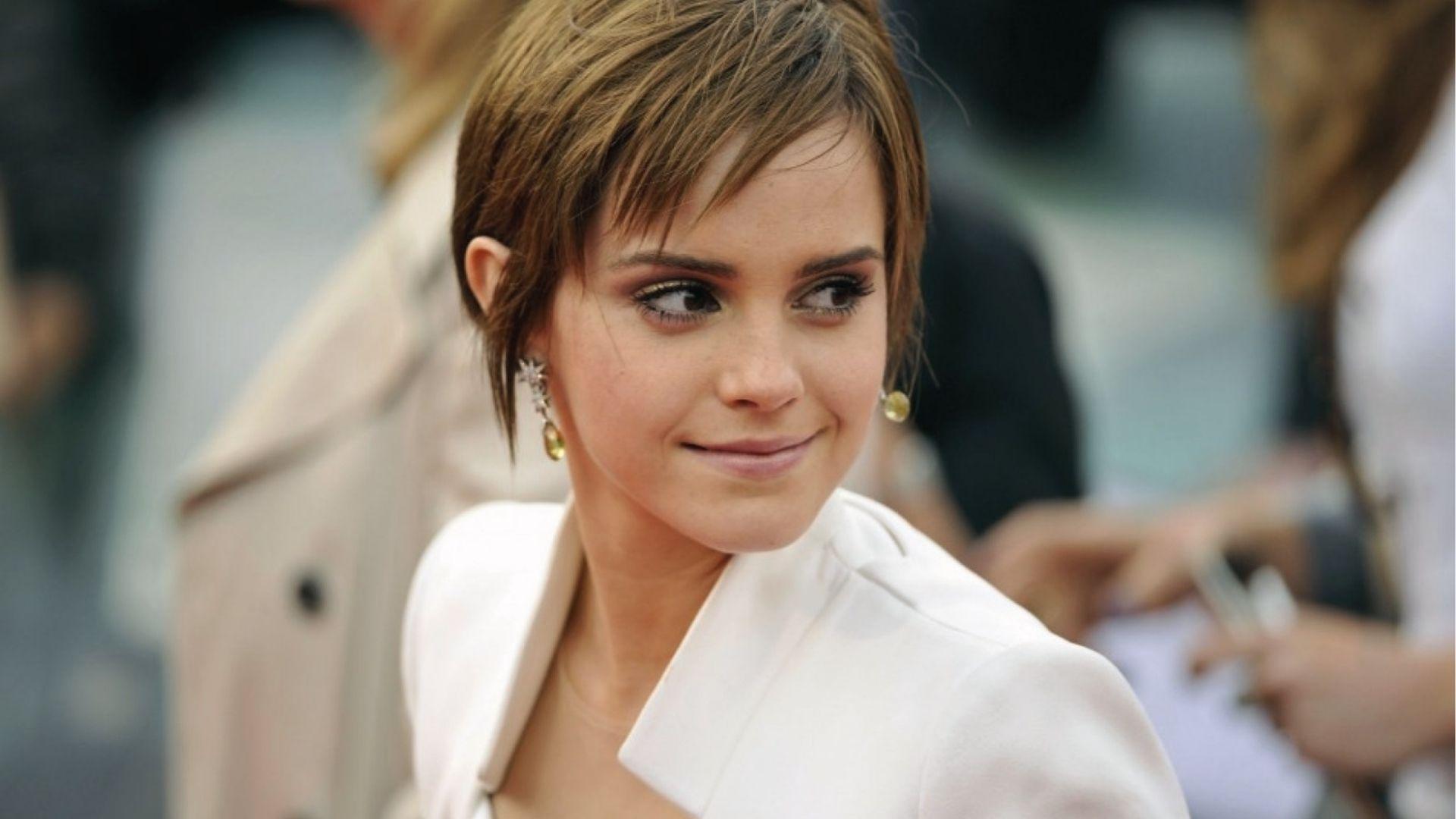 Emma Watson rocks a Long Pixie Cut in white blazer on the red carpet.