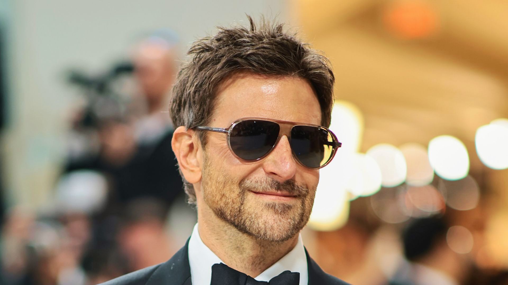 Bradley Cooper showcasing a stylish haircut with Tousled Wavy Medium Hair.