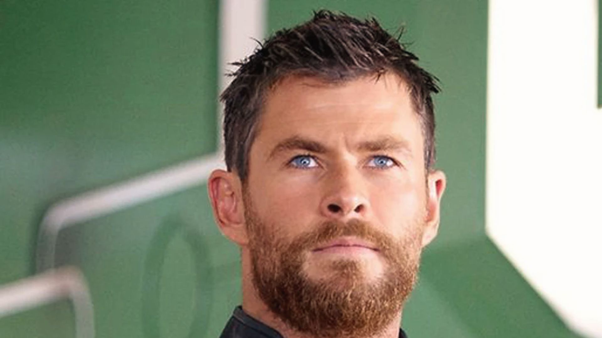 Chris Hemsworth portraying Thor in Avengers: featuring a short textured crop hairstyle reminiscent of Thor: Ragnarok.