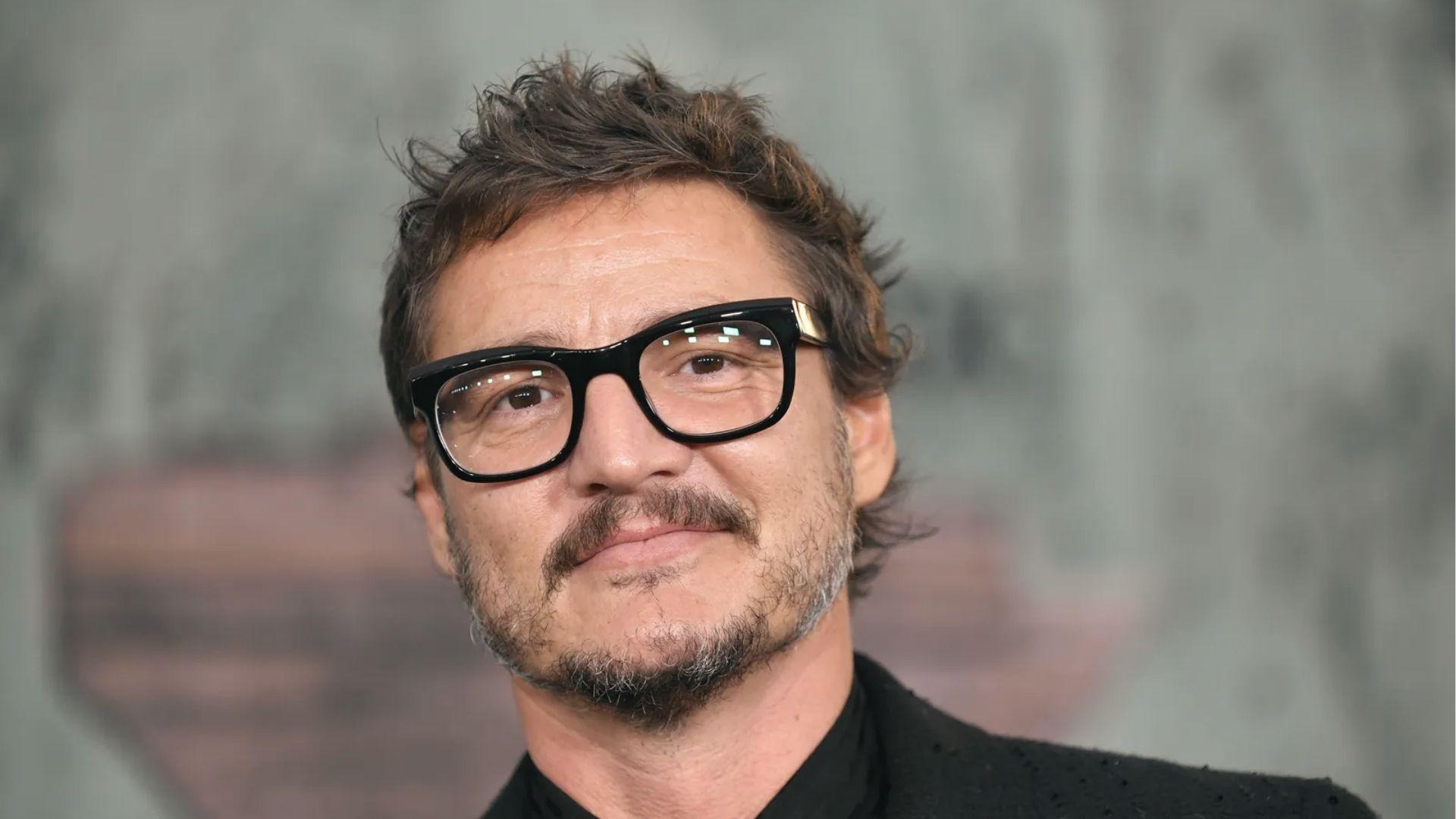 Pedro Pascal with messy textured haircut, thick black glasses and trimmed beard at movie premiere