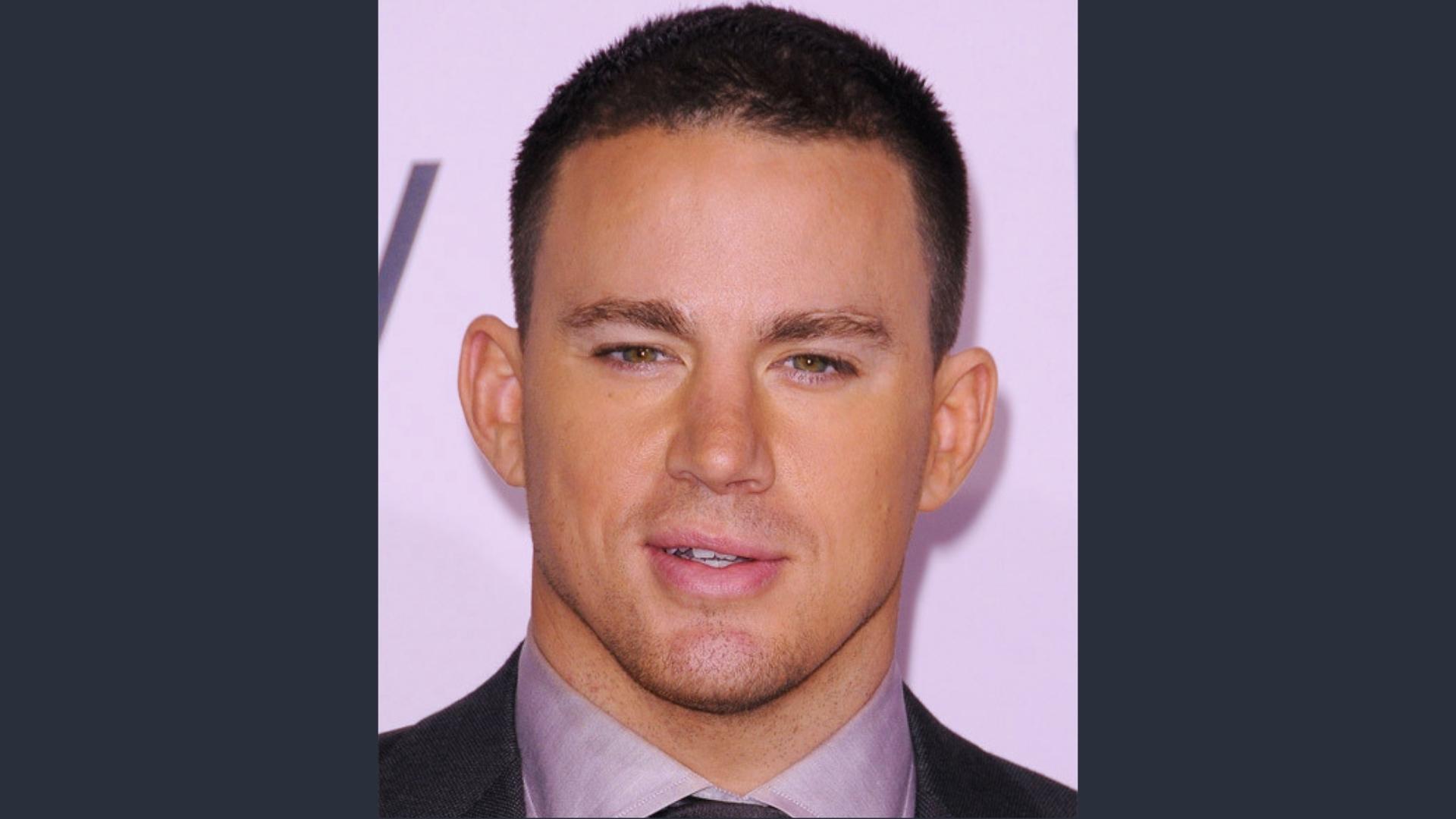 Channing Tatum poses with a neat butch cut buzz style and sharp hairline, paired with a suit for formal events.