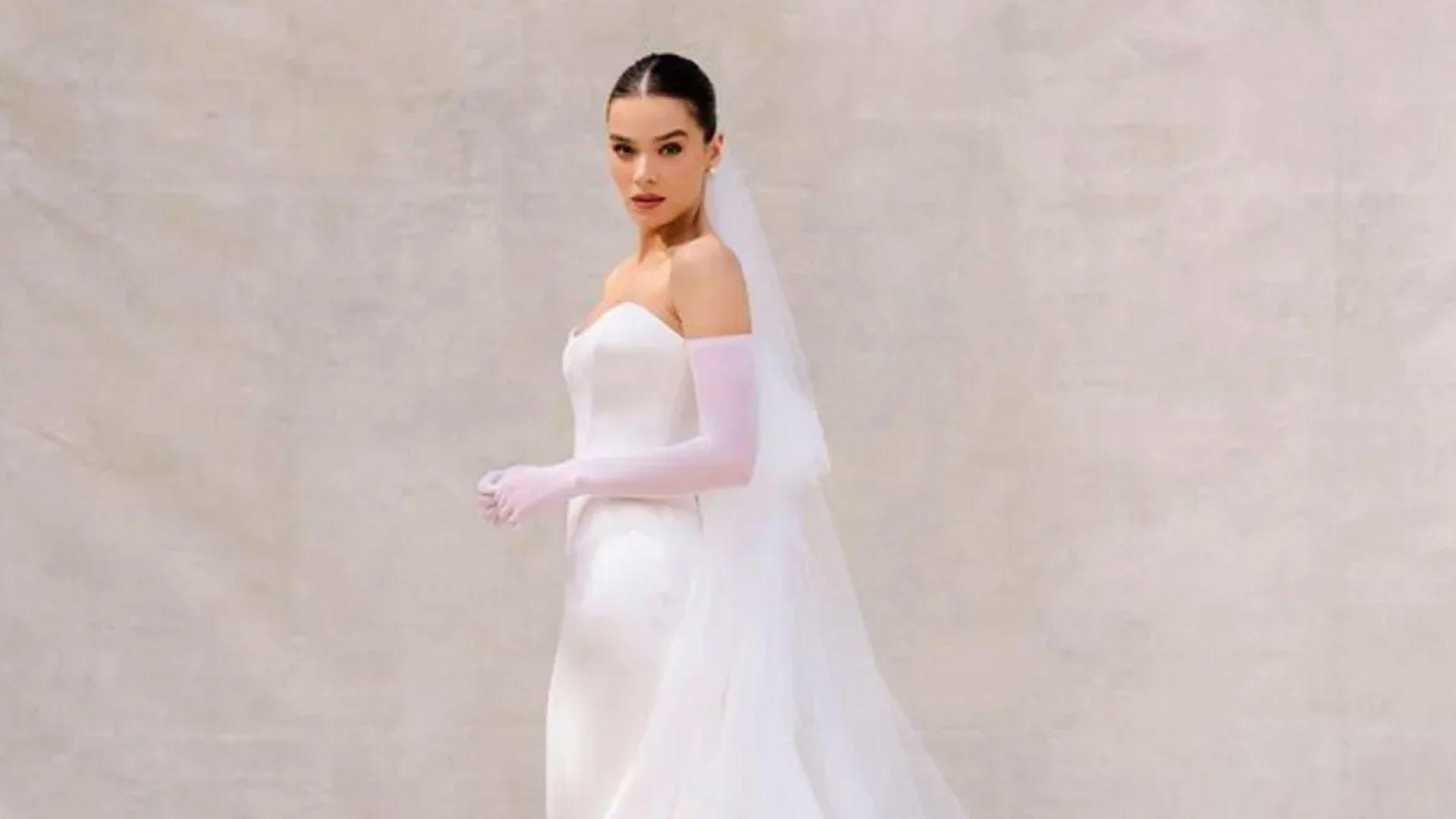 Hailee's wearing a Tamara Ralph couture wedding dress featuring elegant bridal detailing and luxury design.