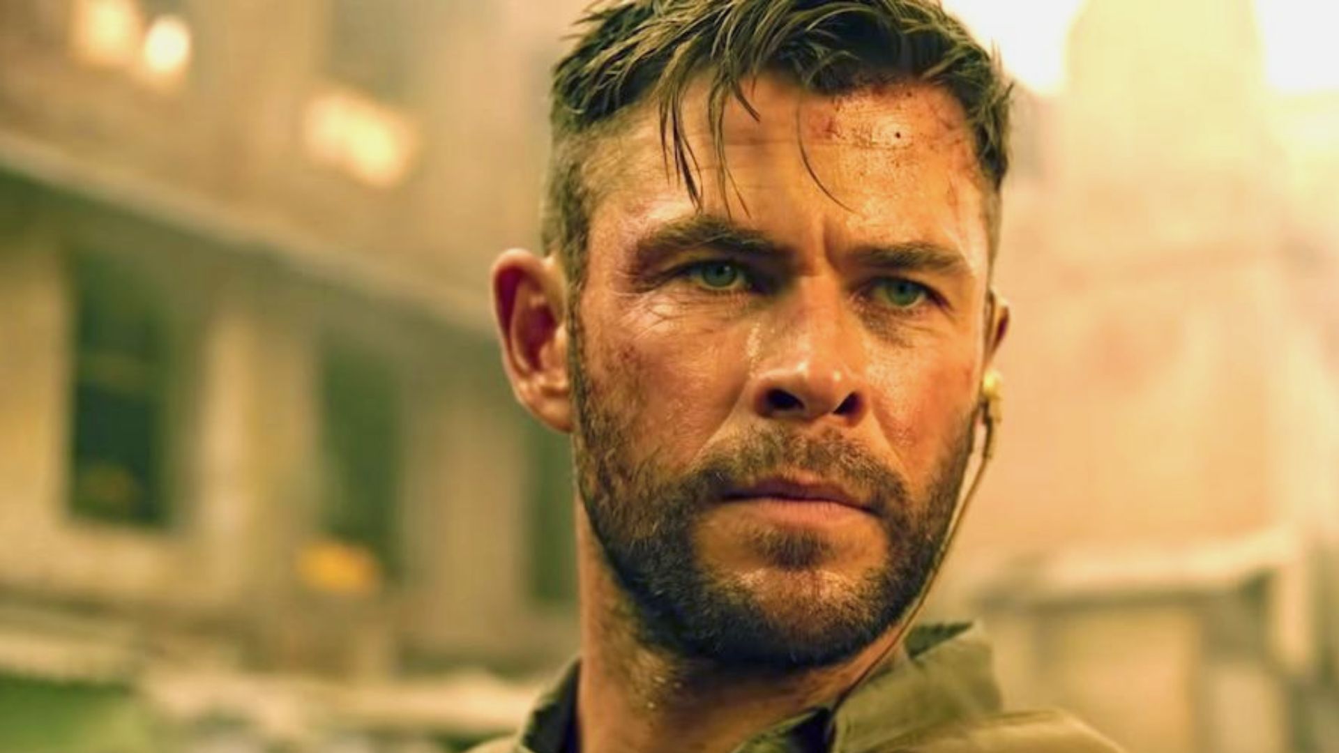 A bearded man, showcasing a hairstyle inspired by Chris Hemsworth's best looks.