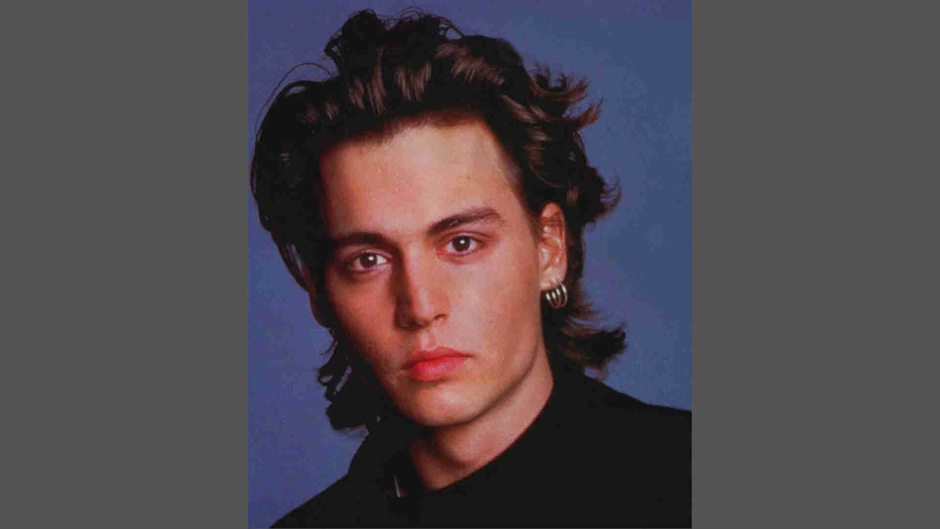 Messy shaggy mullet hairstyle on Johnny Depp with layers, short sides, longer back, and natural face close-up