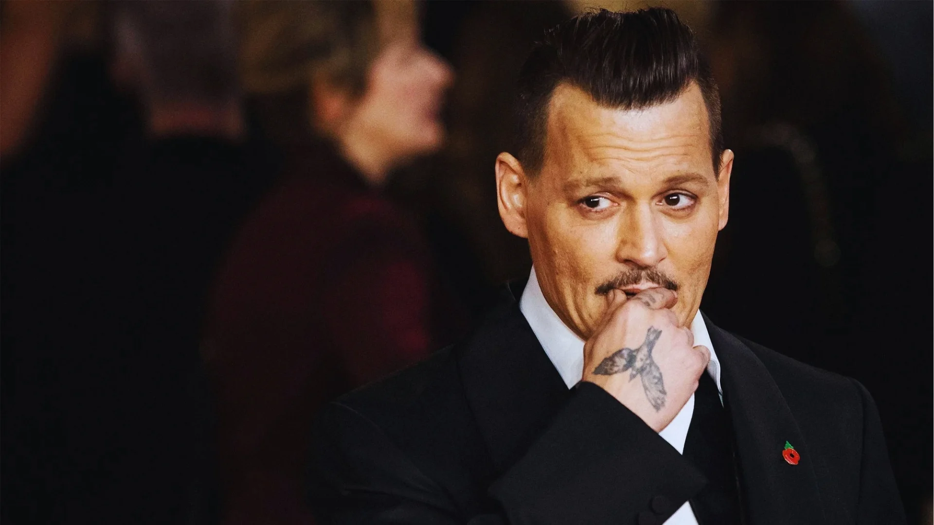 Classic quiff hairstyle on Johnny Depp with high front volume, clean sides, structured look