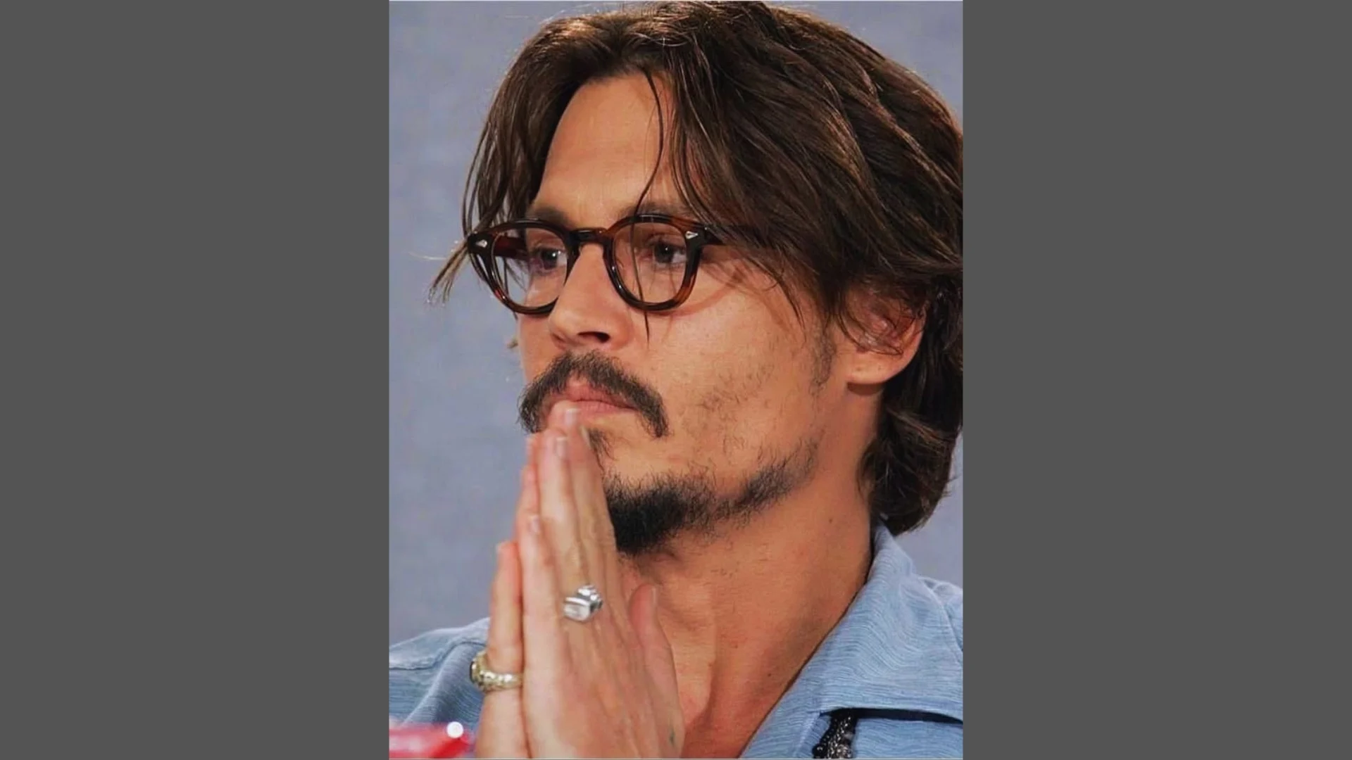 Bro flow natural hairstyle on Johnny Depp with free-flowing waves, minimal styling, relaxed look, and face close-up