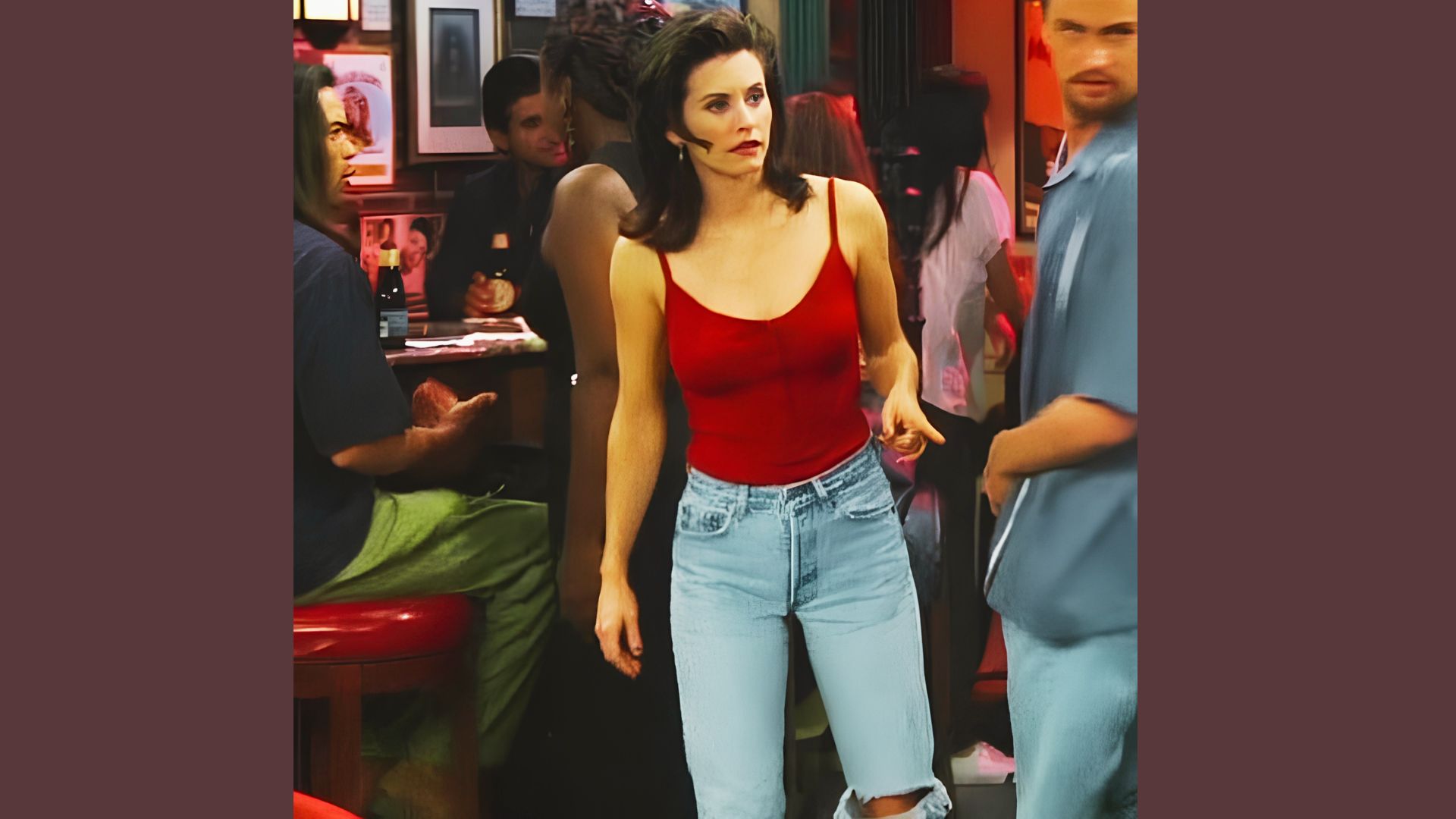Red tank top and high-waisted mom jeans inspired by Monica Geller