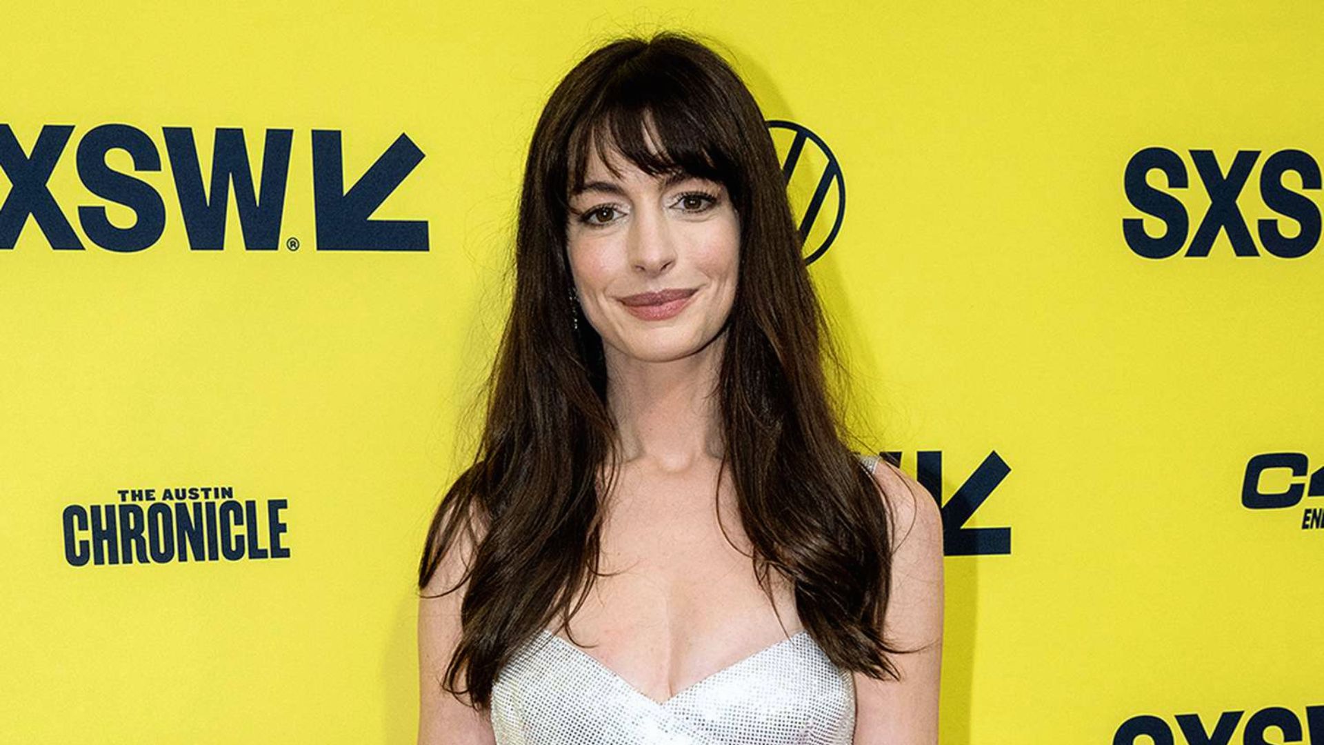Anne Hathaway 2024 The Idea of You press tour soft waves - long hair with bangs look