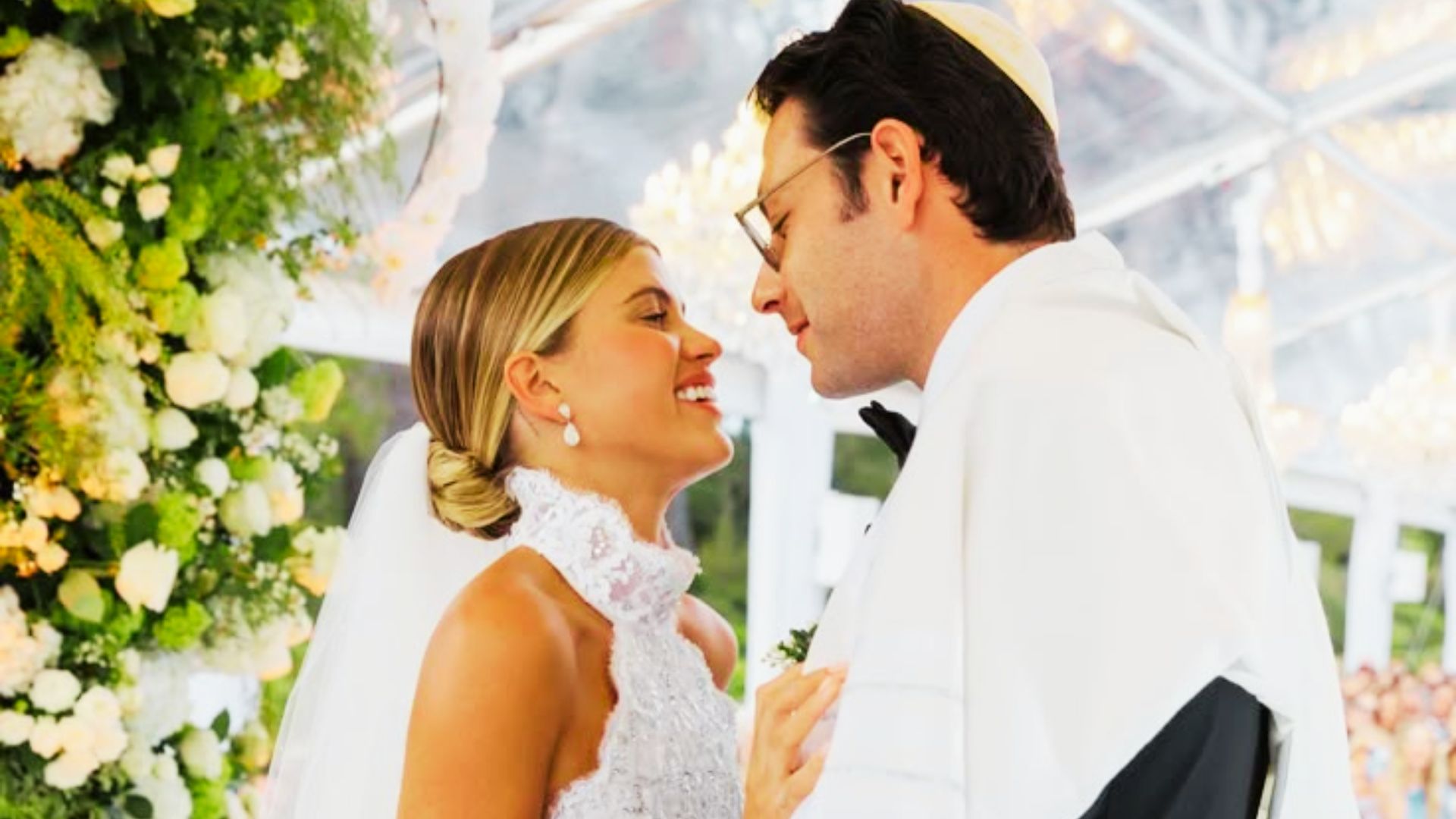 Sofia Richie and Elliot Grainge sharing a close moment at their 2023 wedding ceremony in the South of France.