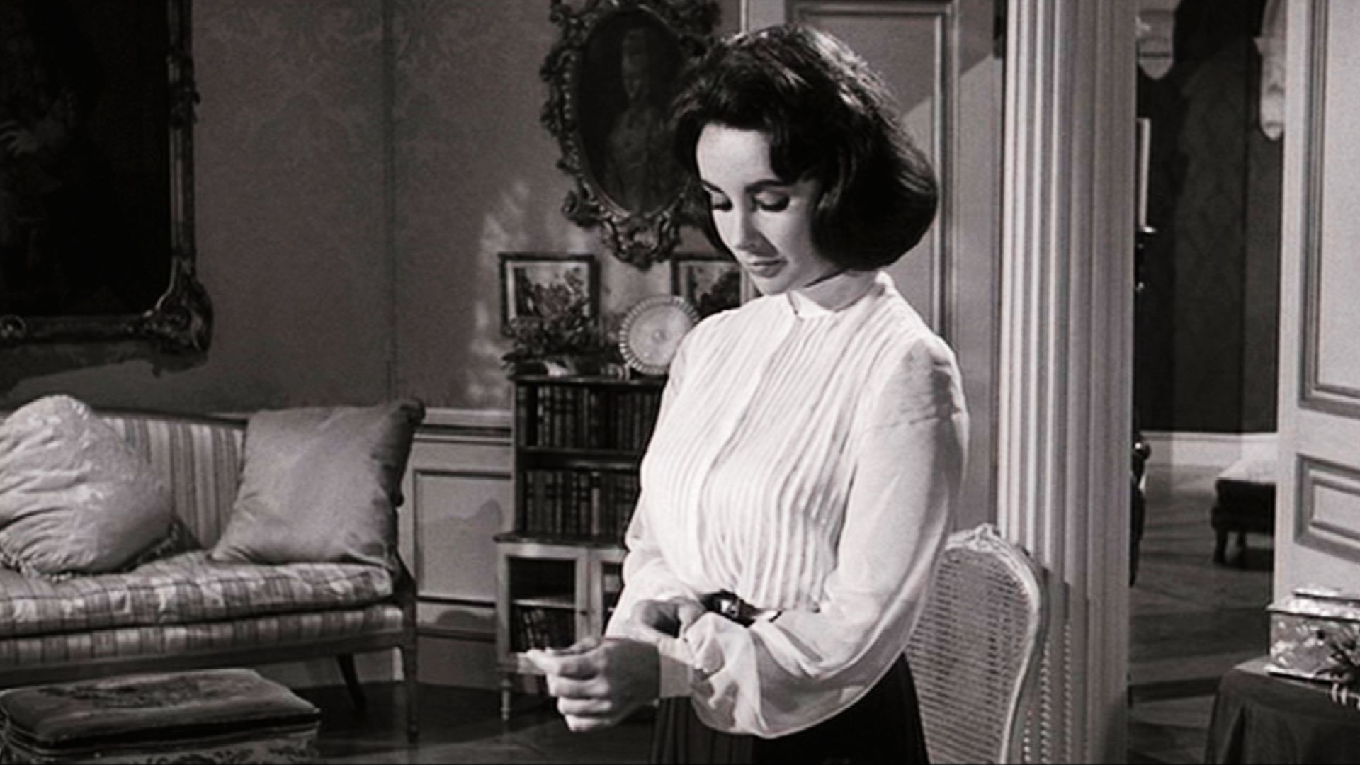 Elizabeth in white blouse with high neckline