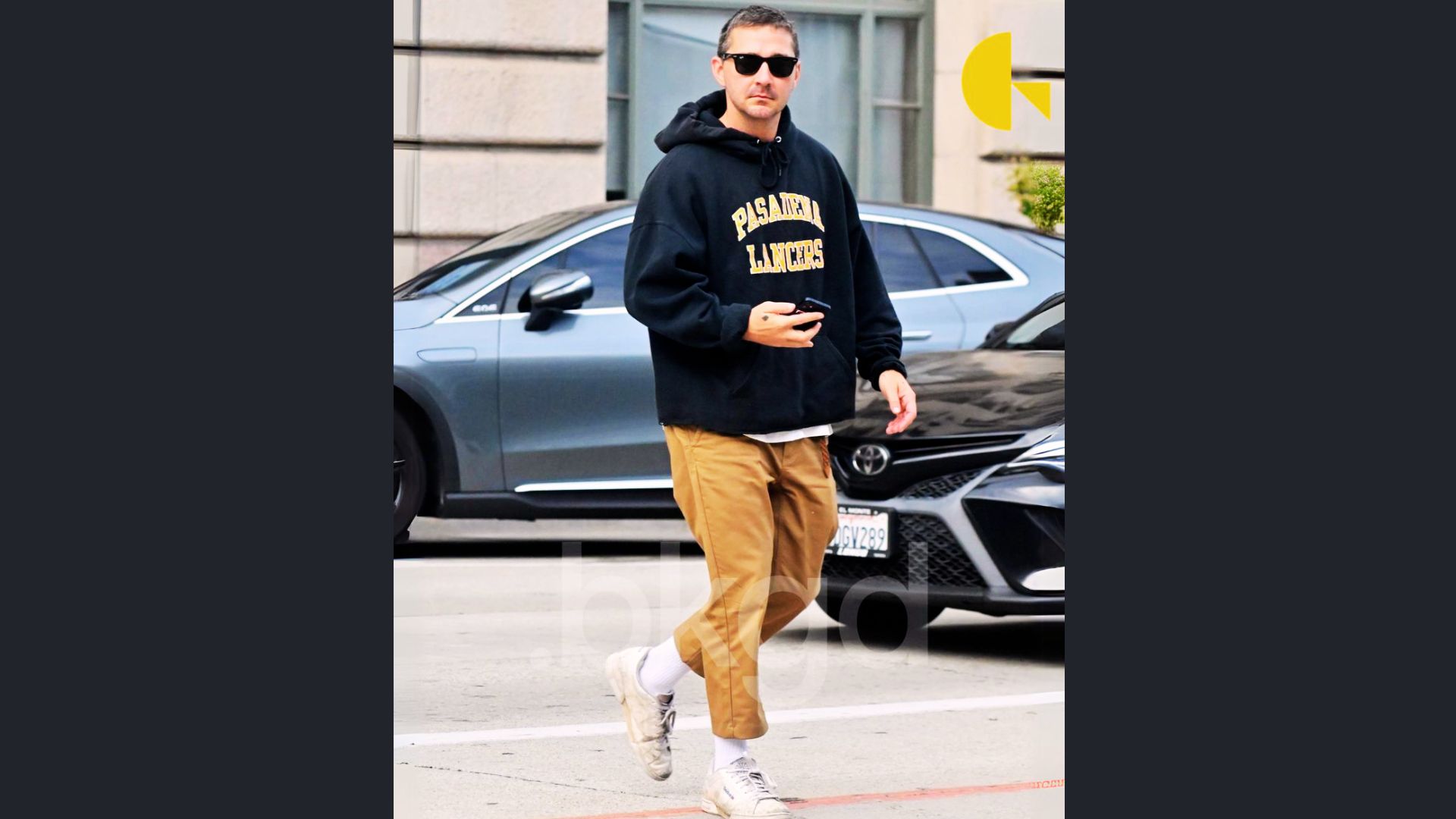 Casual street style outfit of Shia LaBeouf walking through the city