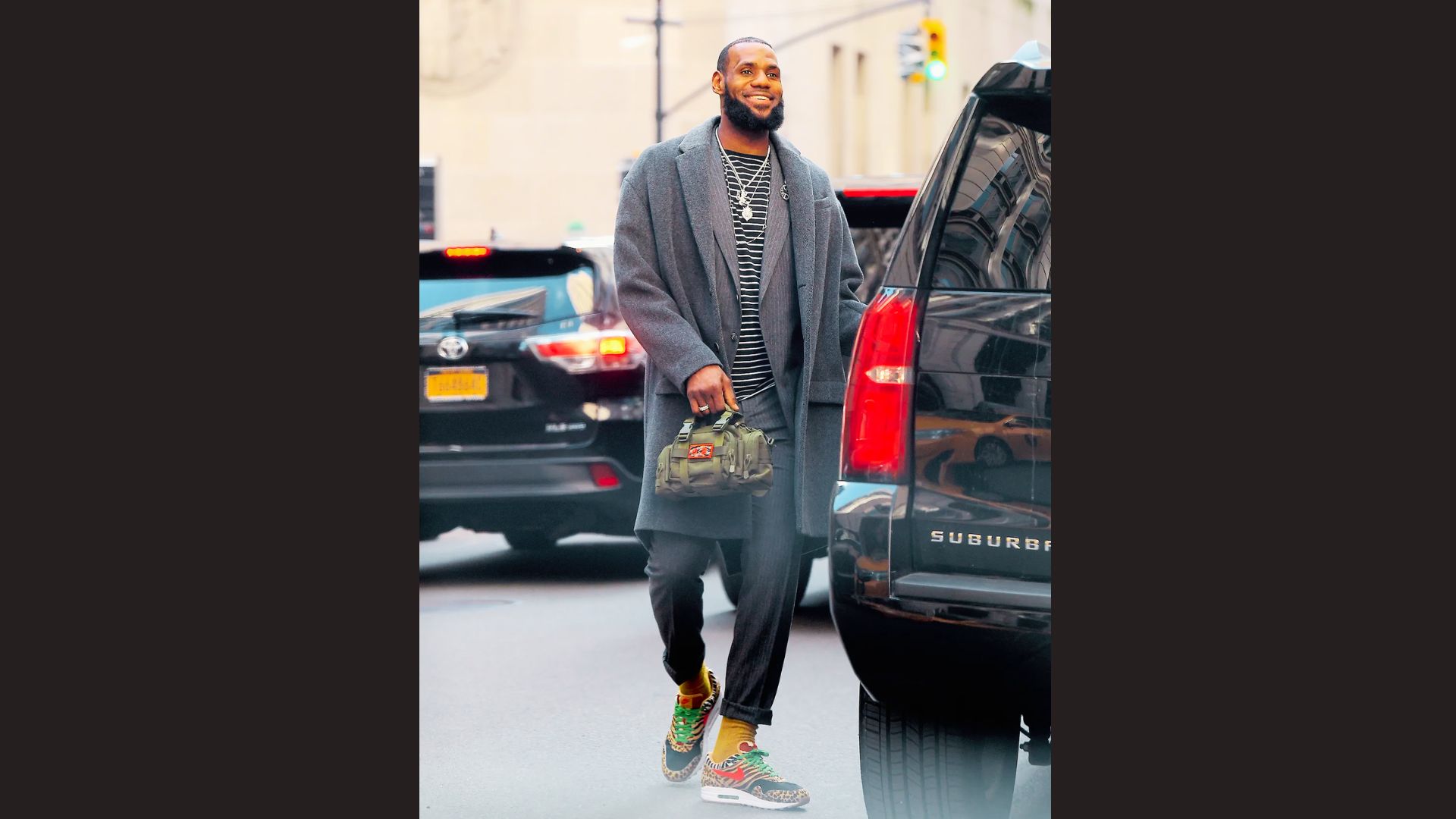 LeBron James Grey suit styled with bold statement sneakers.