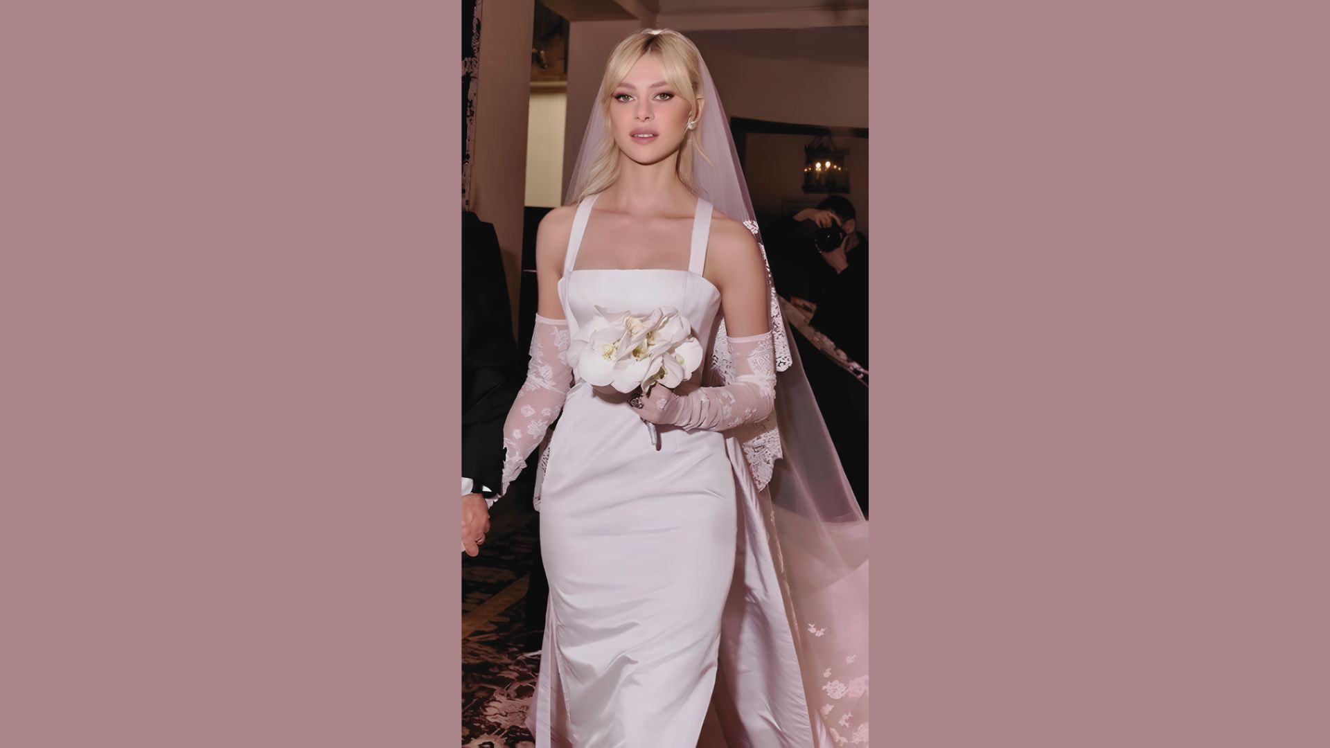 Minimalist wedding dress featuring a square neckline and cathedral train.