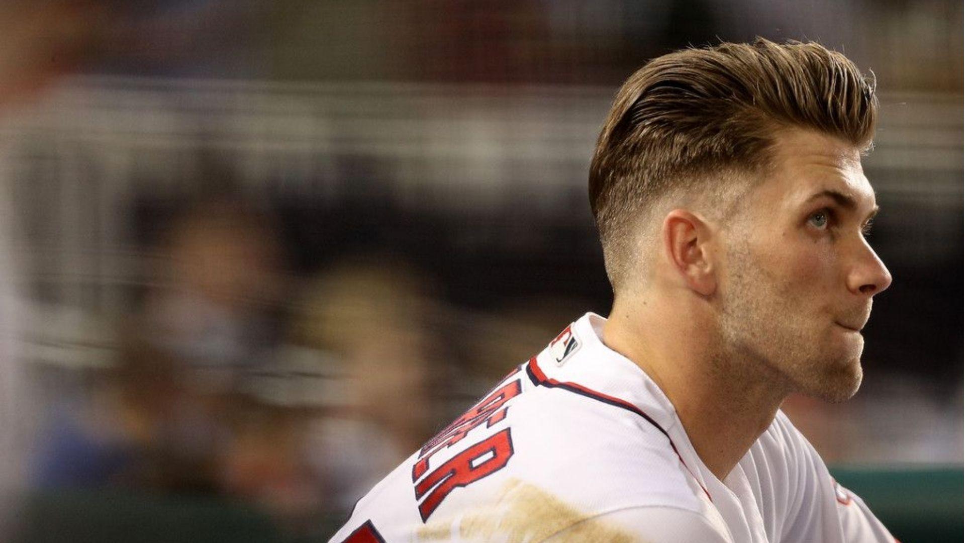 Popular Bryce Harper haircut with textured top and fade.